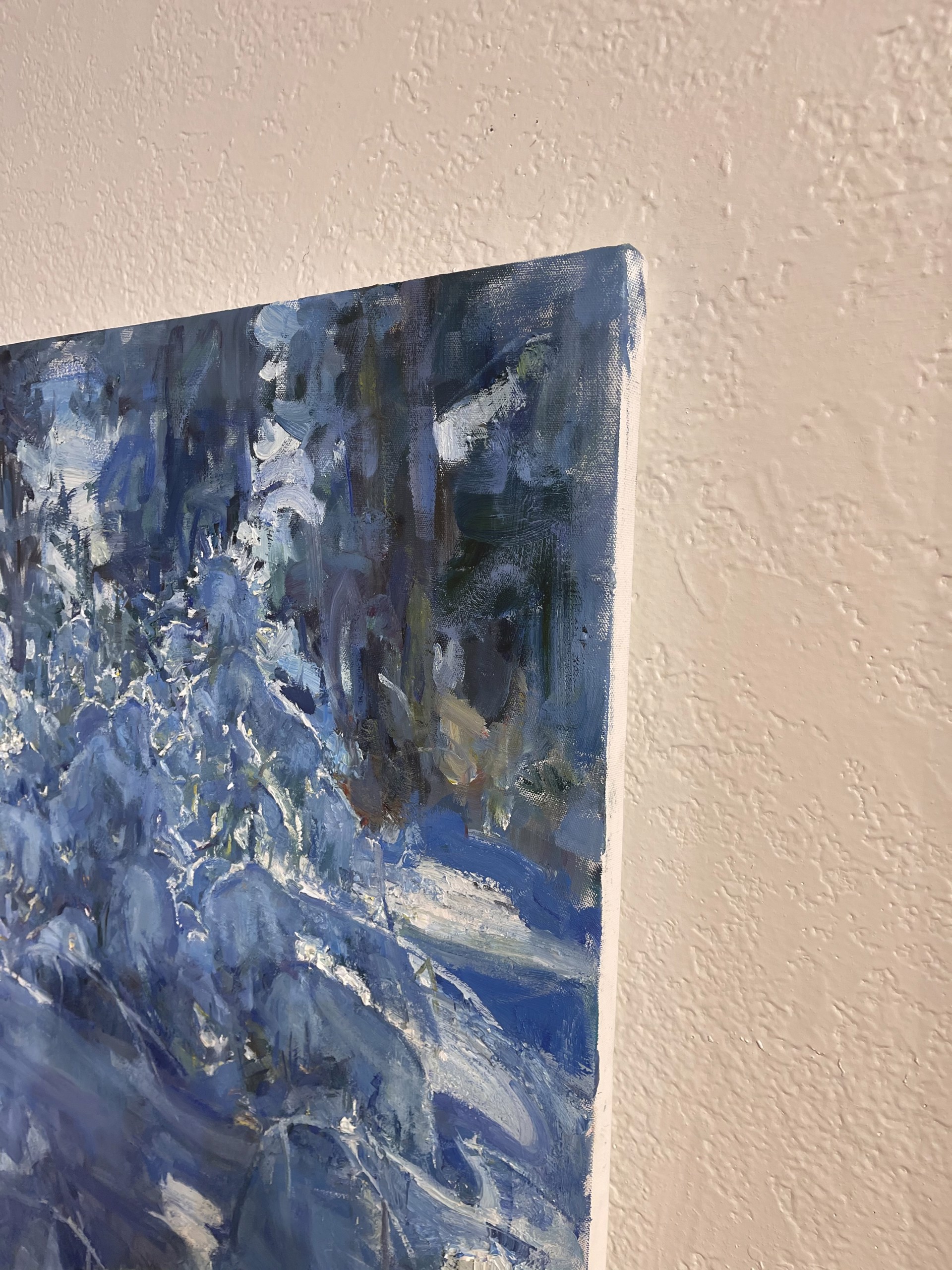A painting of a snowy landscape with trees in the background.