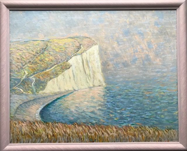 a painting of the cliffs of etretat by claude monet