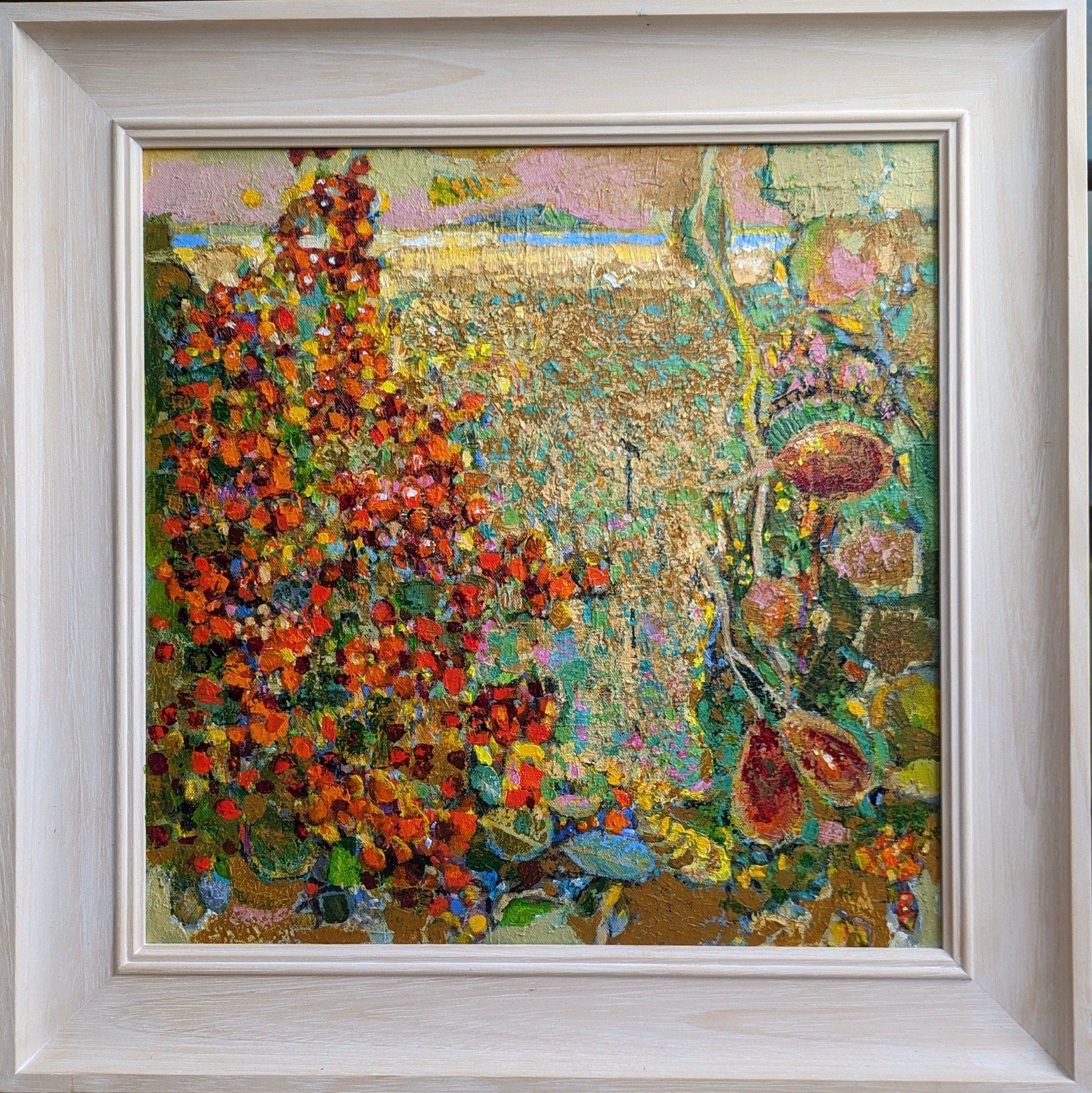 A painting of a field of flowers in a white frame.