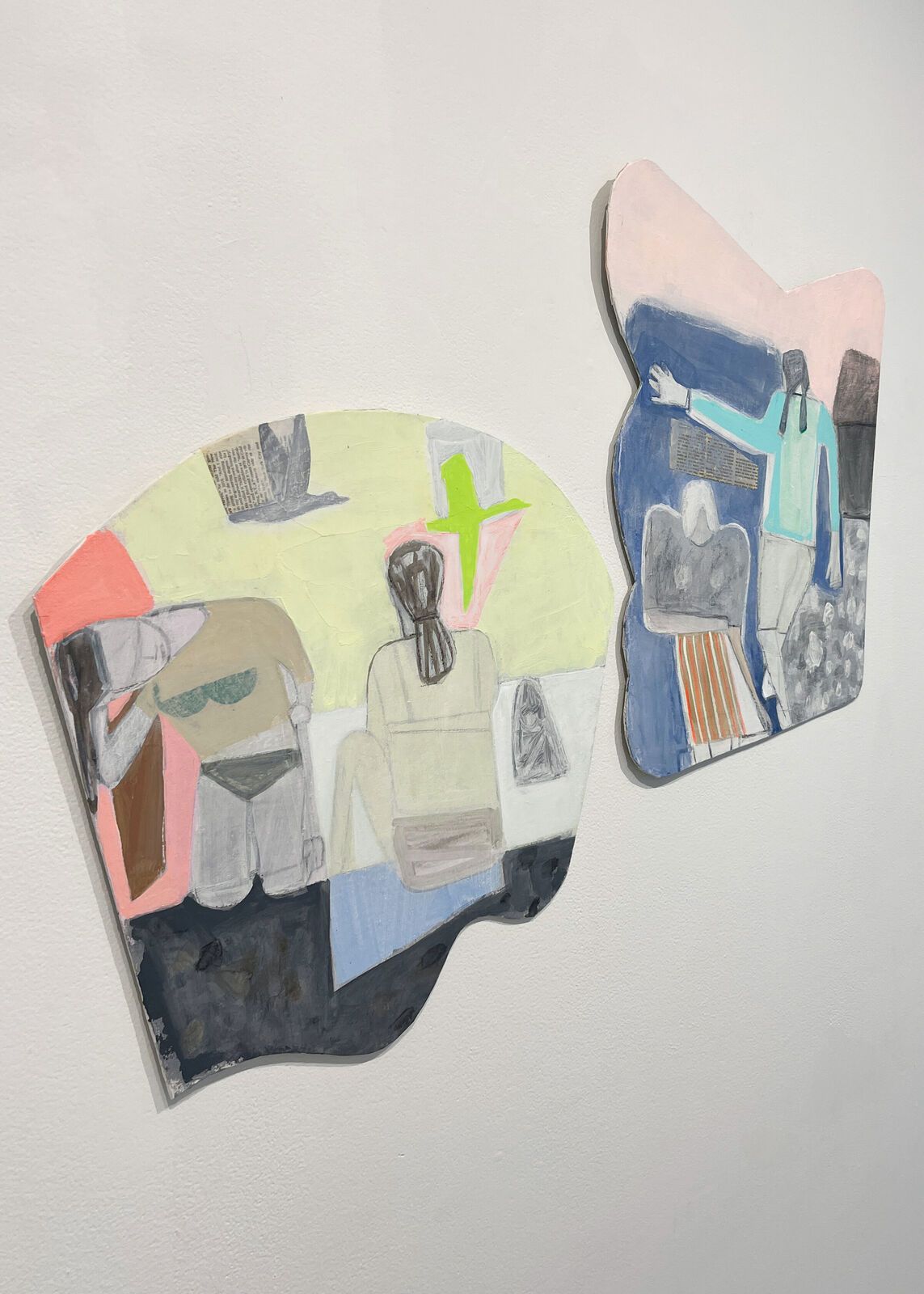 A colorful, abstract painting of two figures sitting at a table.