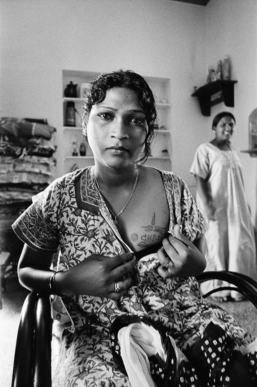 A woman sitting in a chair in a room.