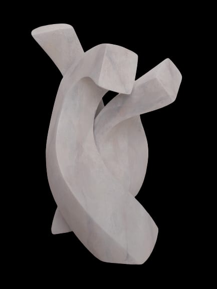 a white sculpture on a black background