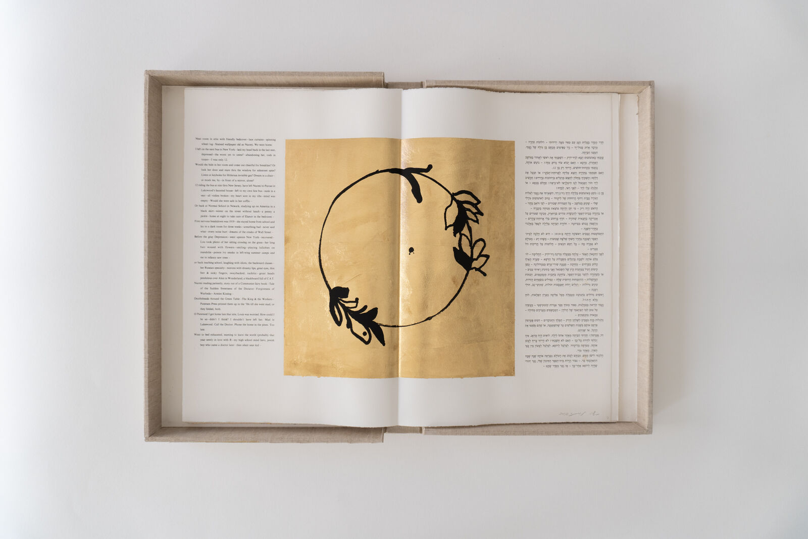 an open book with a drawing of a circle on it