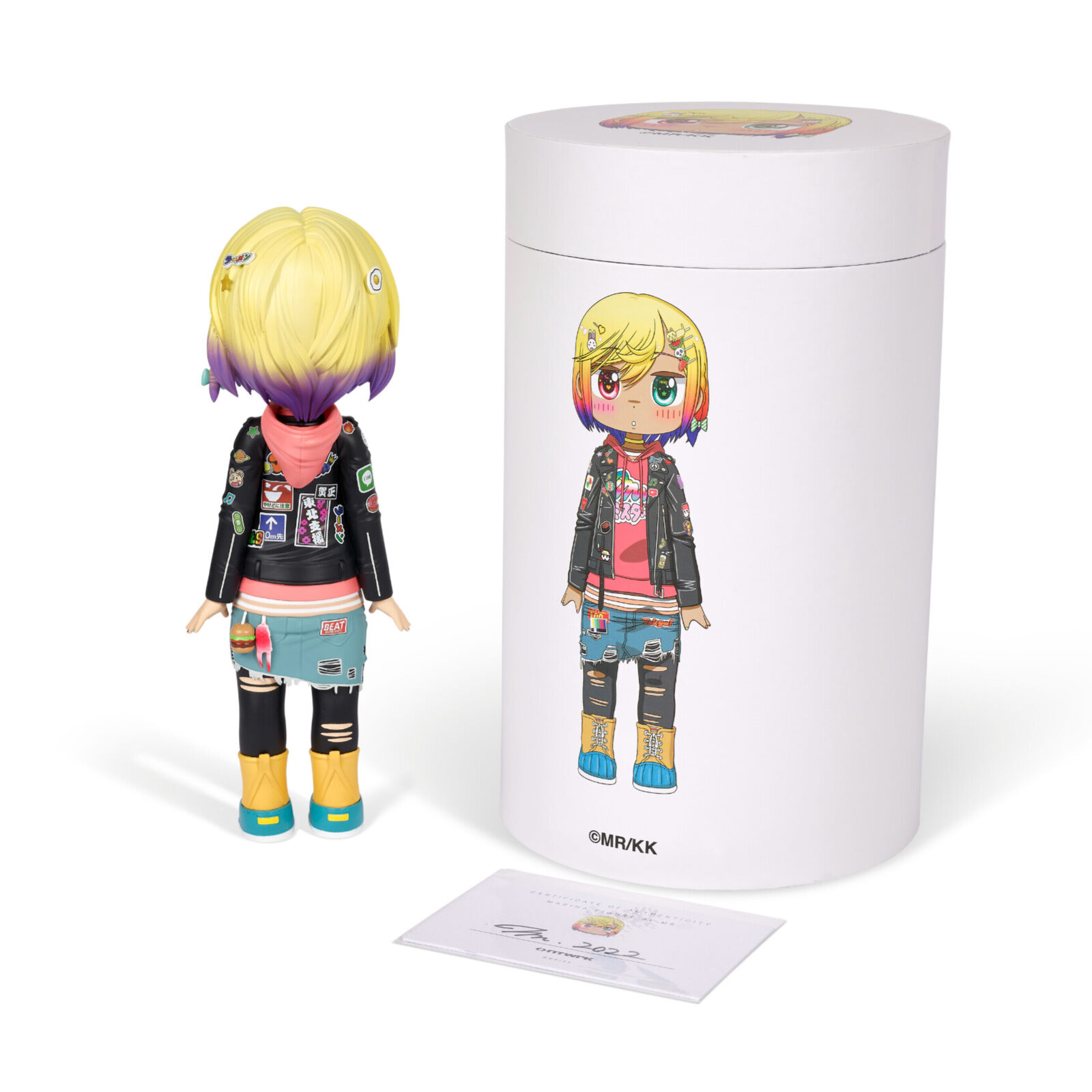 A doll with blonde hair wearing a black jacket and blue jeans.