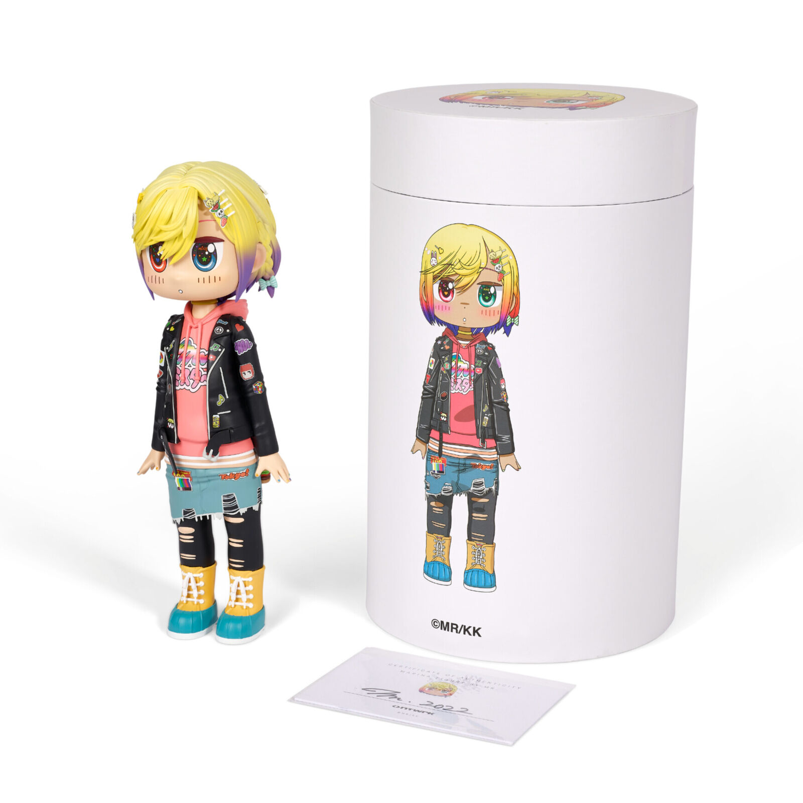 A doll with blonde hair wearing a black jacket and blue jeans.