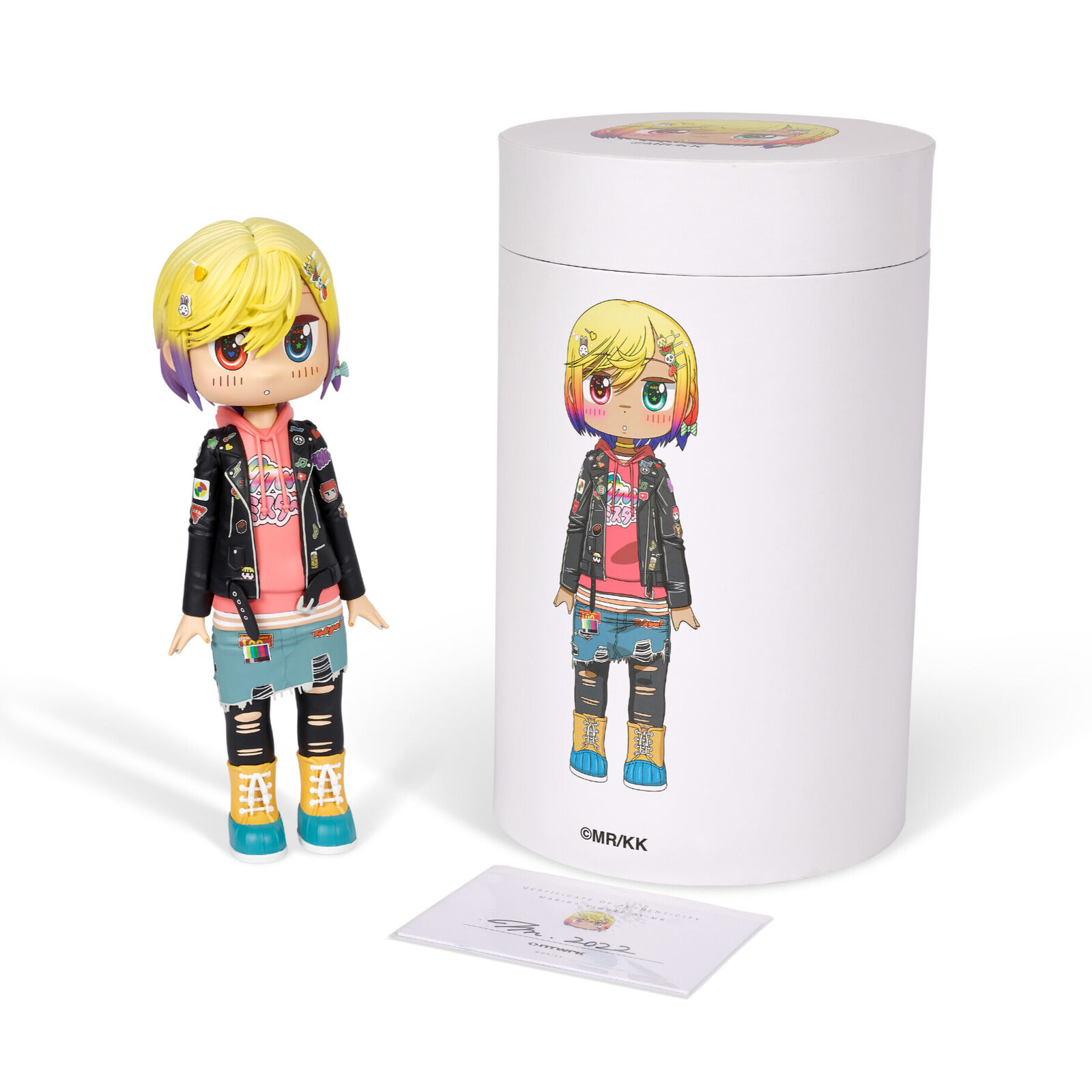 A doll with blonde hair wearing a black jacket and blue jeans.