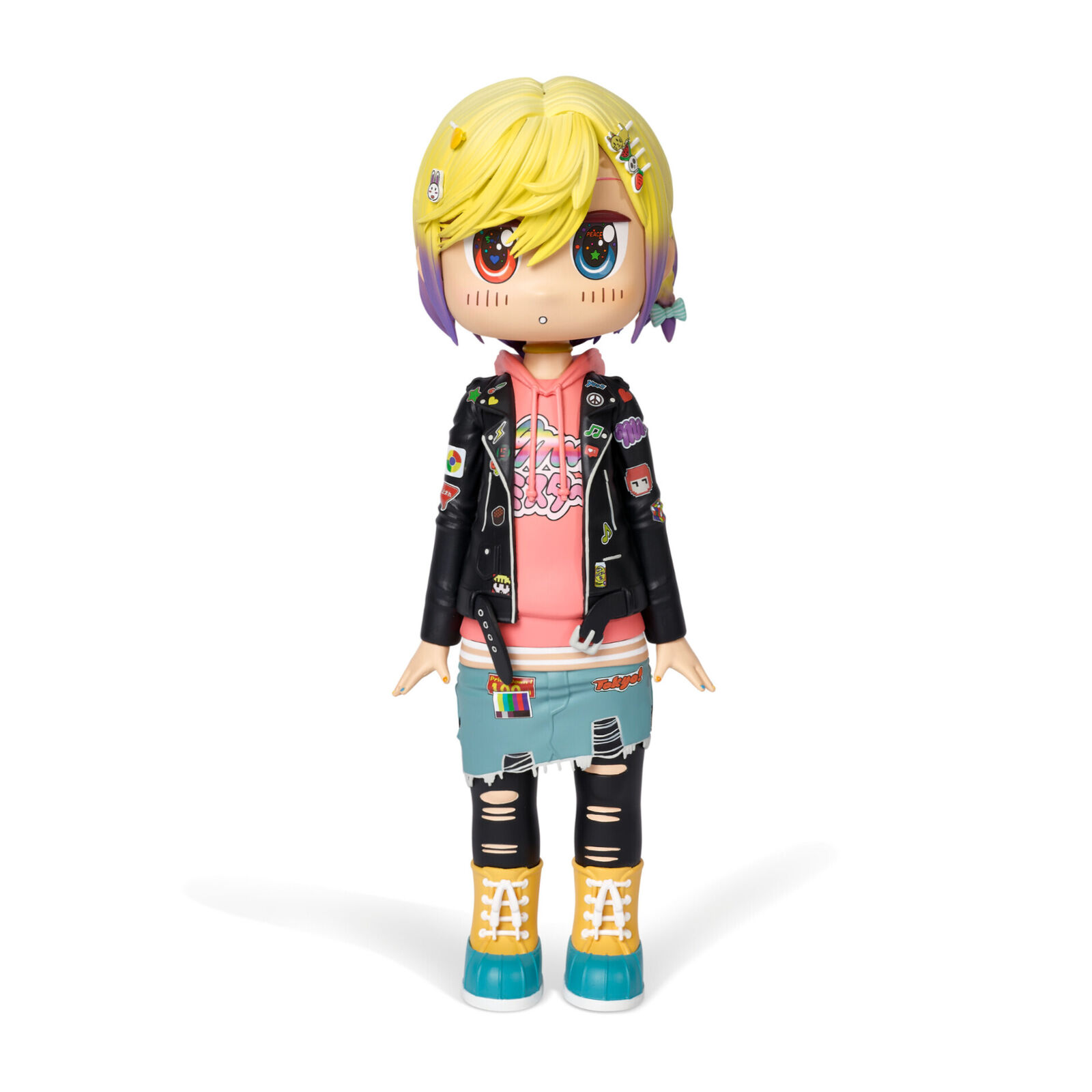 A doll with blonde hair wearing a black jacket and blue jeans.
