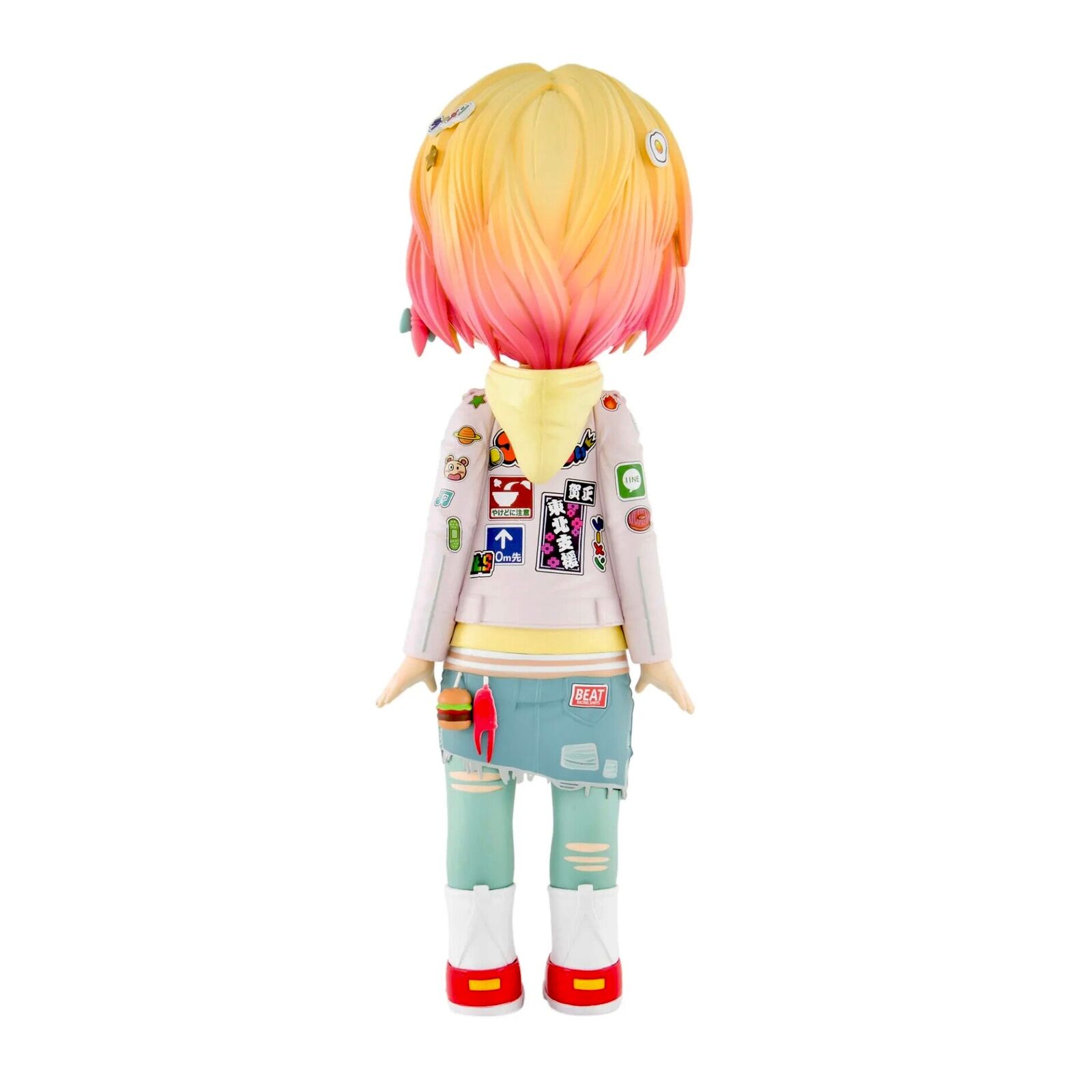 A doll with blonde hair wearing a white jacket and blue jeans.