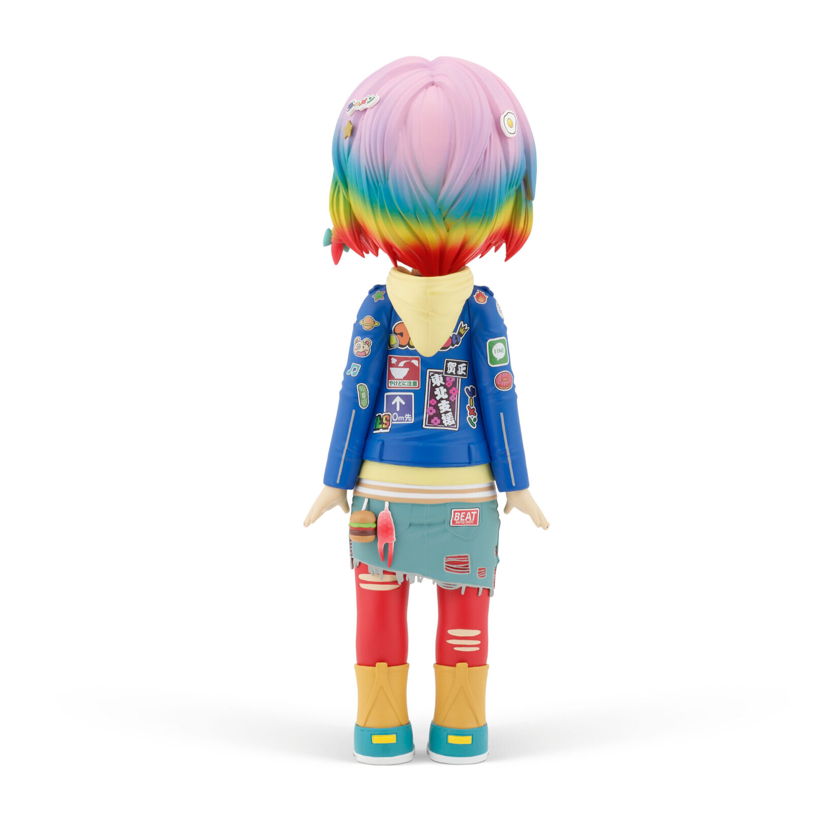 A doll with pink hair wearing a blue jacket and red pants.
