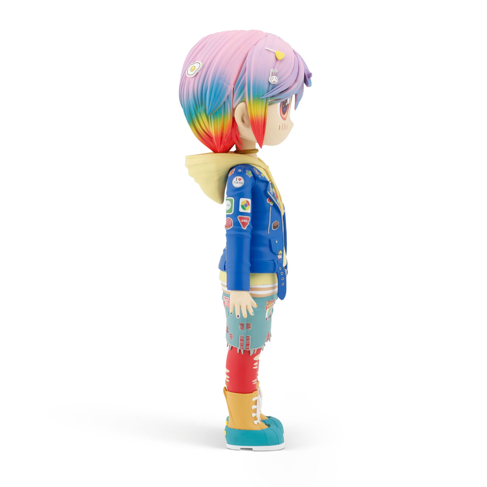 A doll with pink hair wearing a blue jacket and red pants.