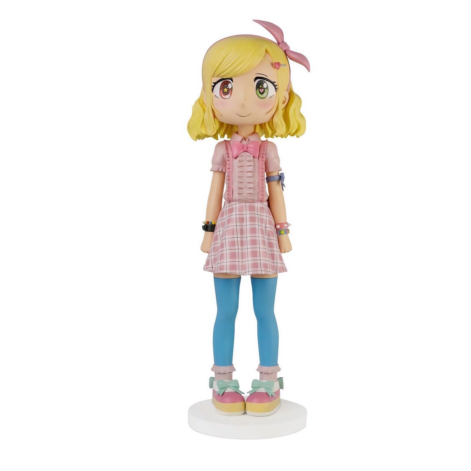 A figurine of a girl in a pink dress and blue tights.