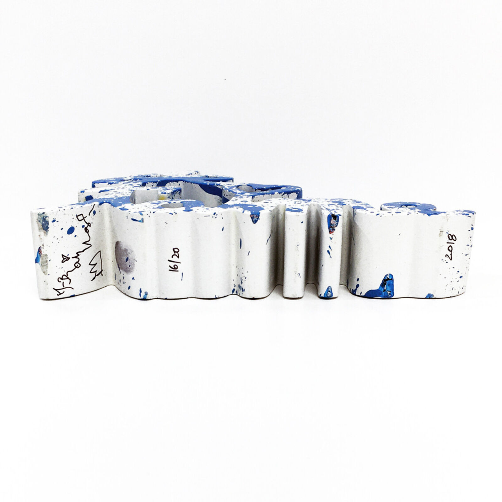 A blue and white sign that says "love" on a white background.