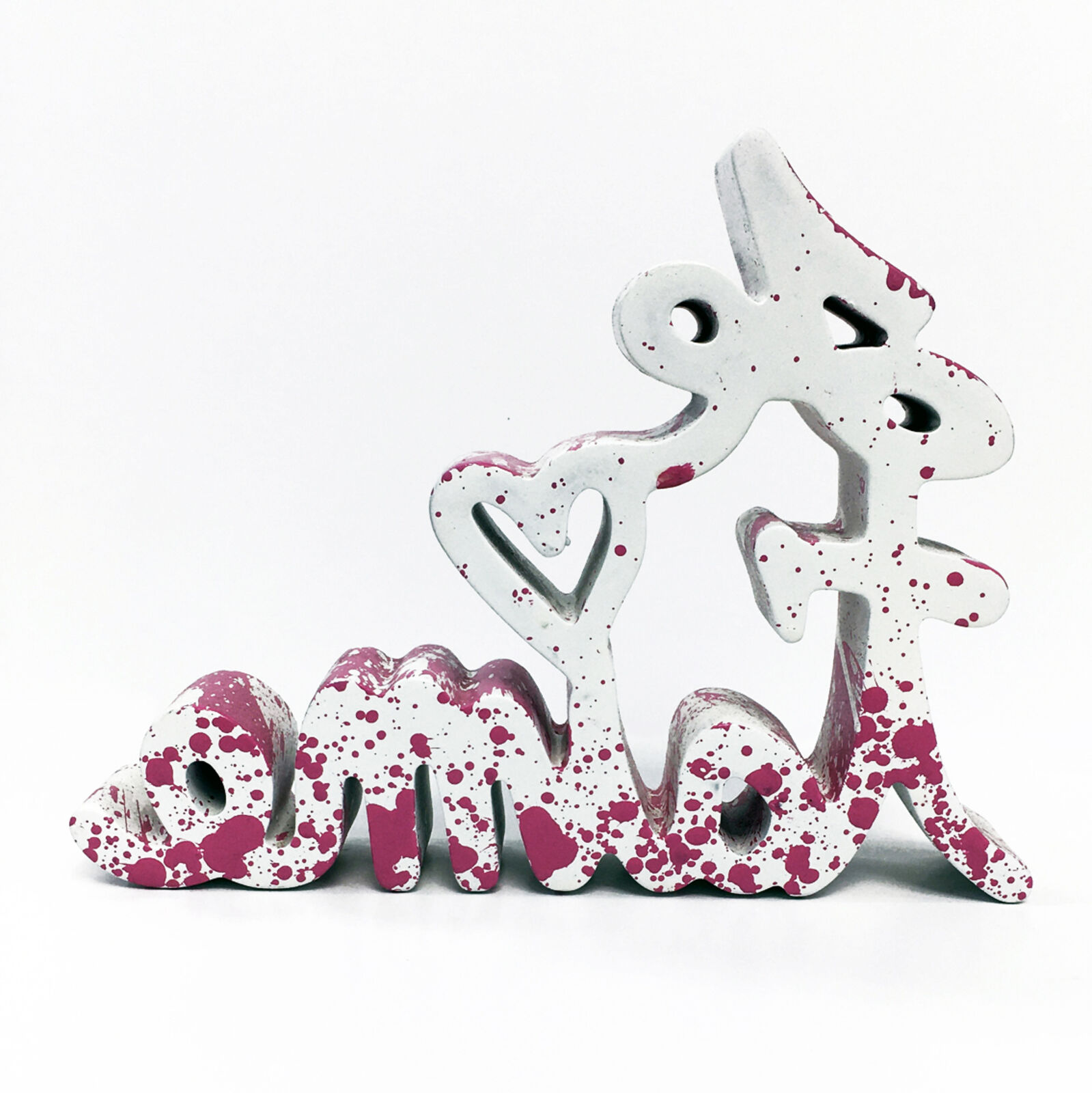 A pink and white wooden sign that says "love" on a white background.