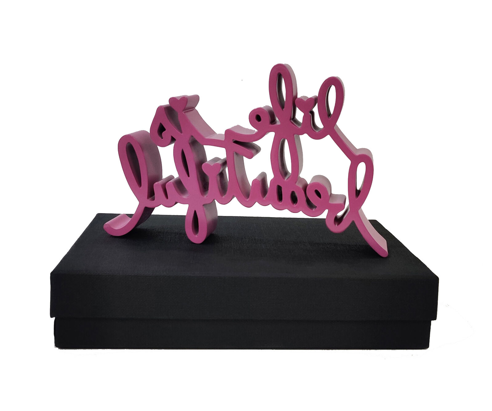 A pink life is beautiful sign on a black box.