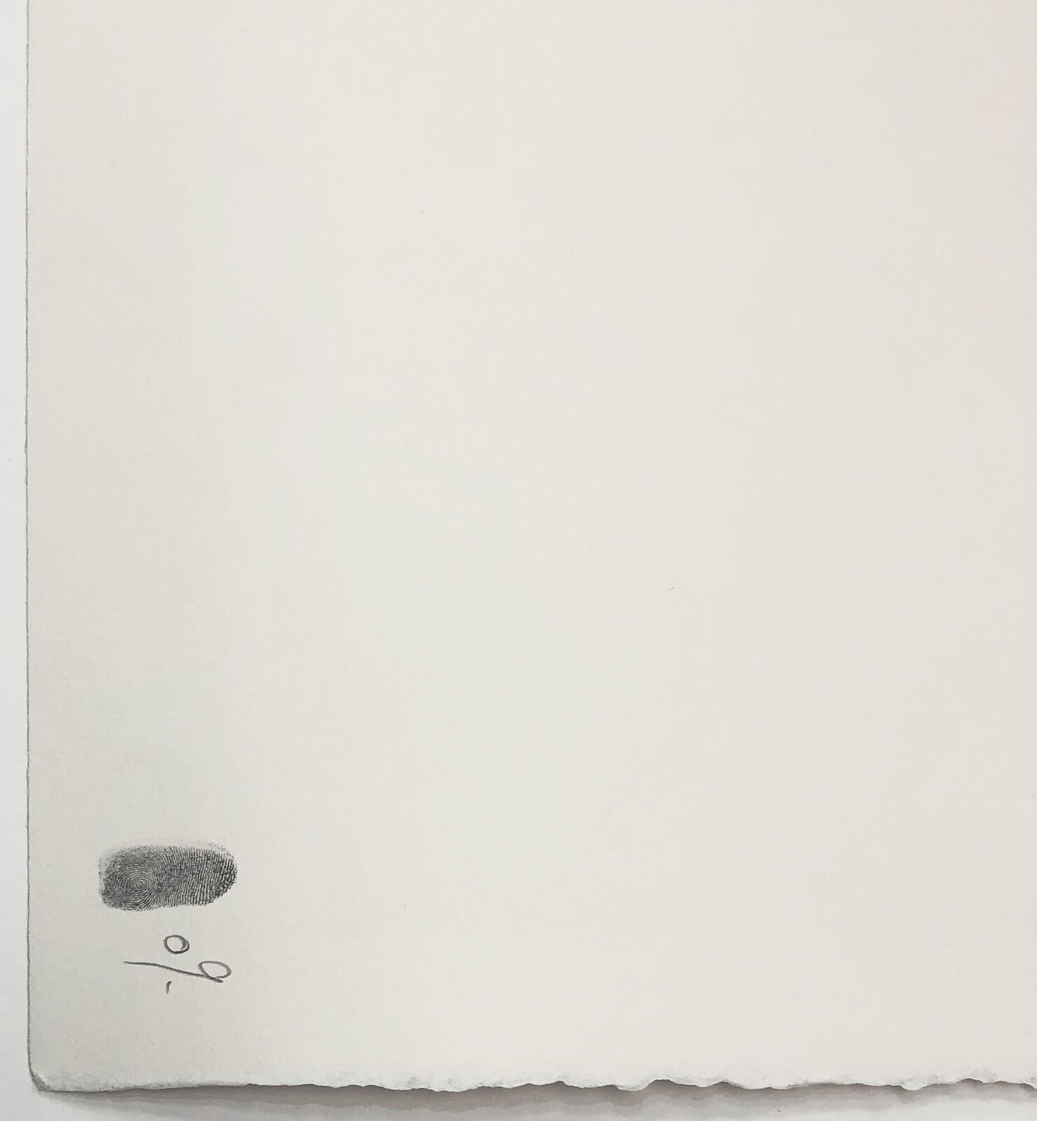 A black and white photo of a man standing in front of a wall with graffiti.