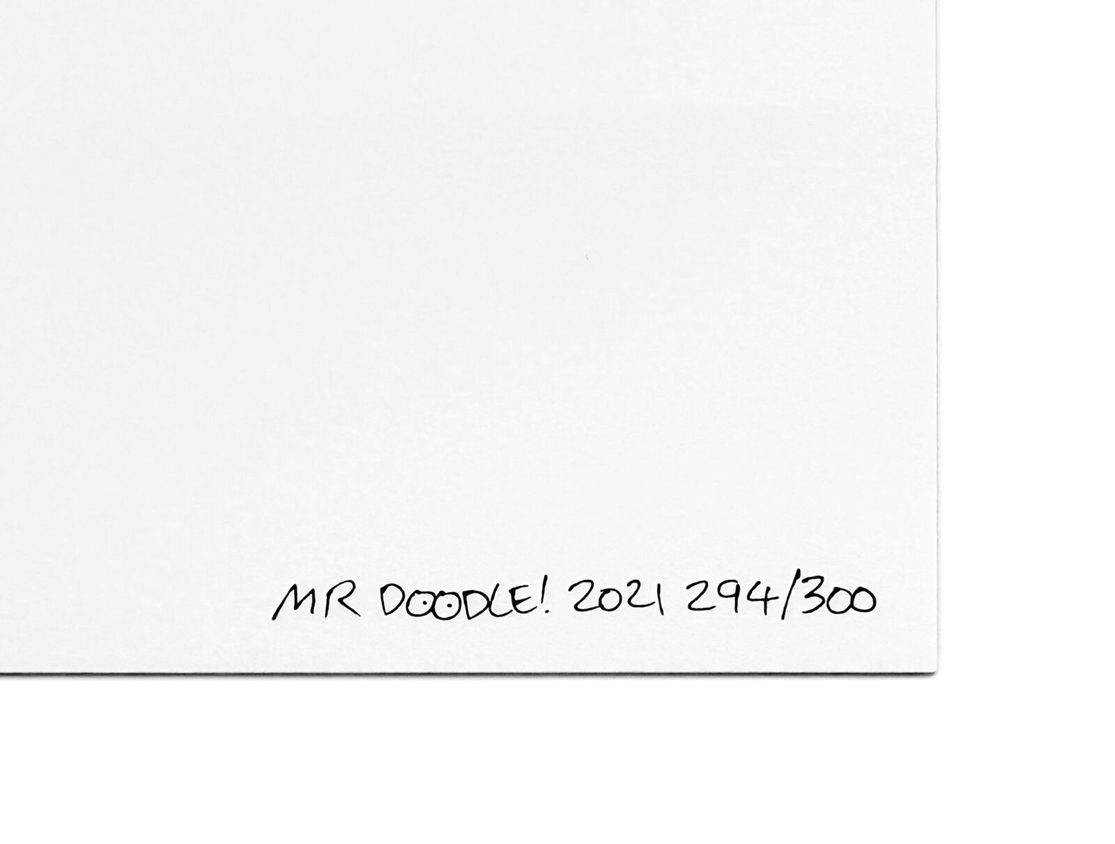 An orange heart made up of doodles in a white frame.