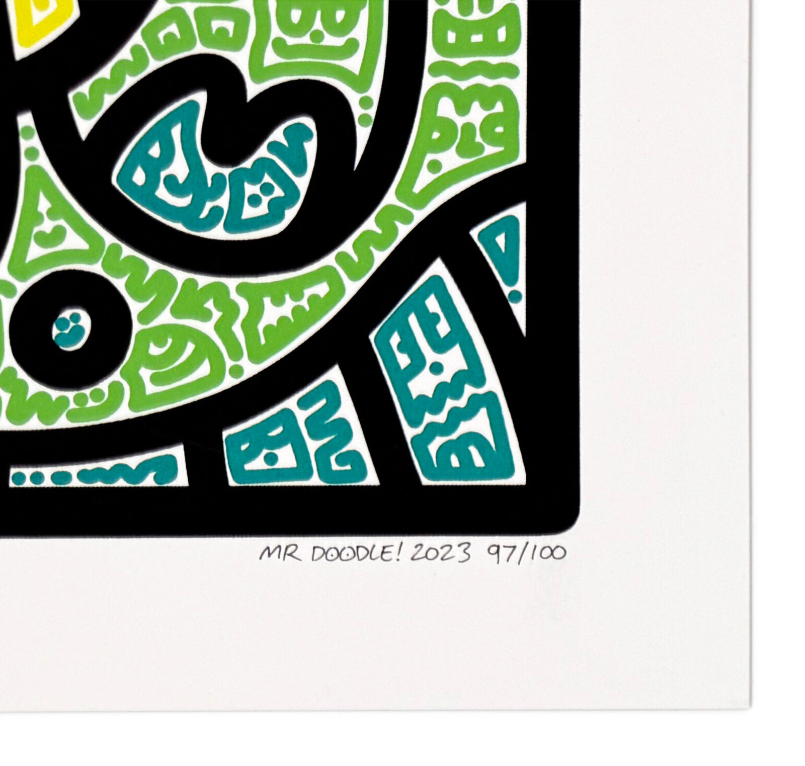 A picture of a colorful abstract painting in a white frame.