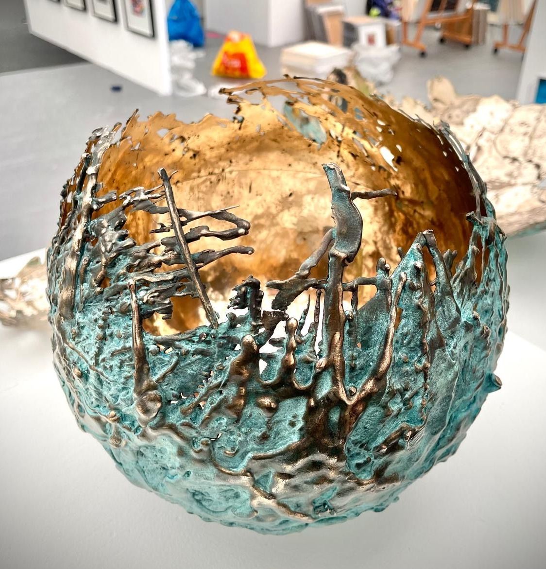 A large metal bowl sitting on top of a table.