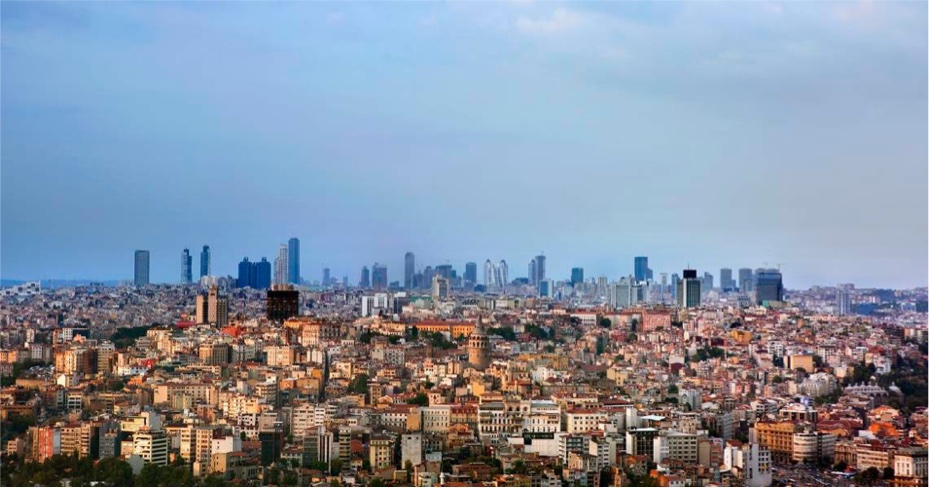 A view of a city with tall buildings in the background.