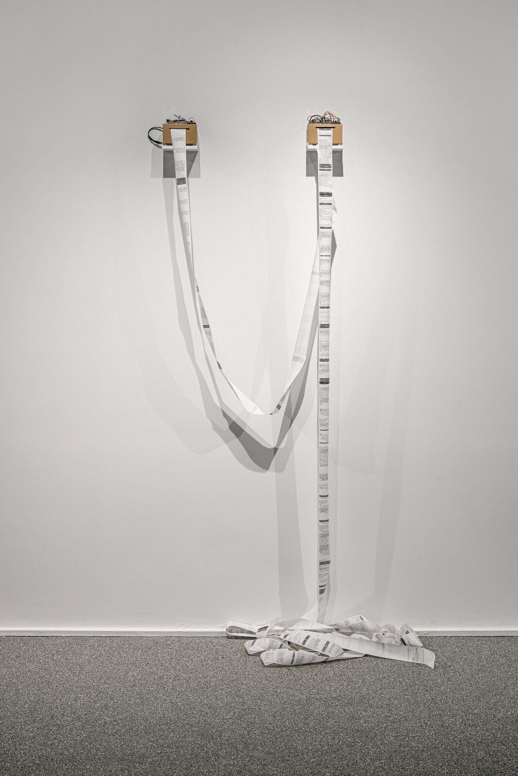 A white wall with a white tape wrapped around it.