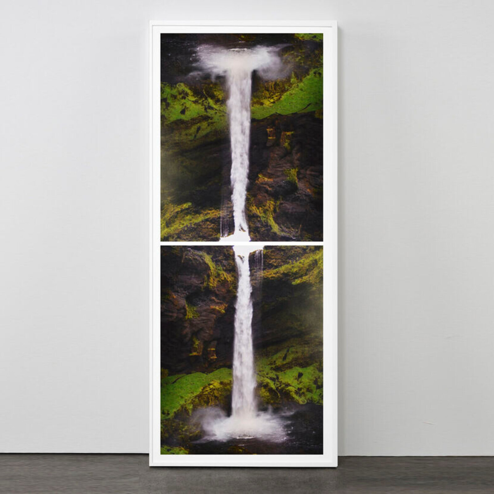 A split-panel framed artwork of a waterfall cascading over mossy rocks.