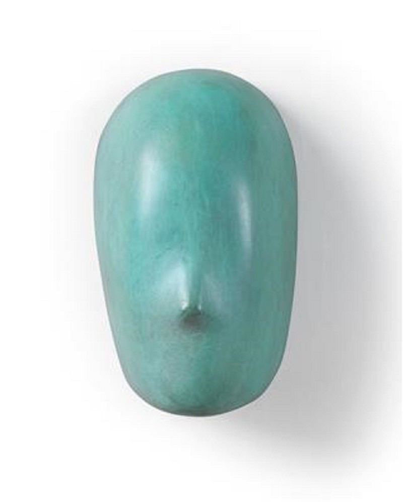 A green sculpture of a man's face on a white background.