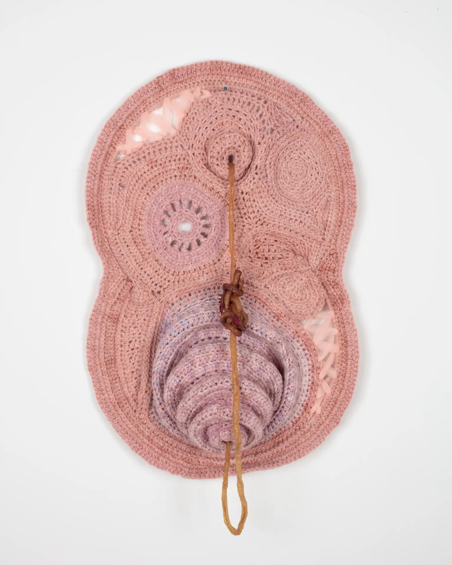 Artwork by Ophelia Arc, rumination loop, Made of Latex, tulle, hand dyed yarn, human hair and wire rings 