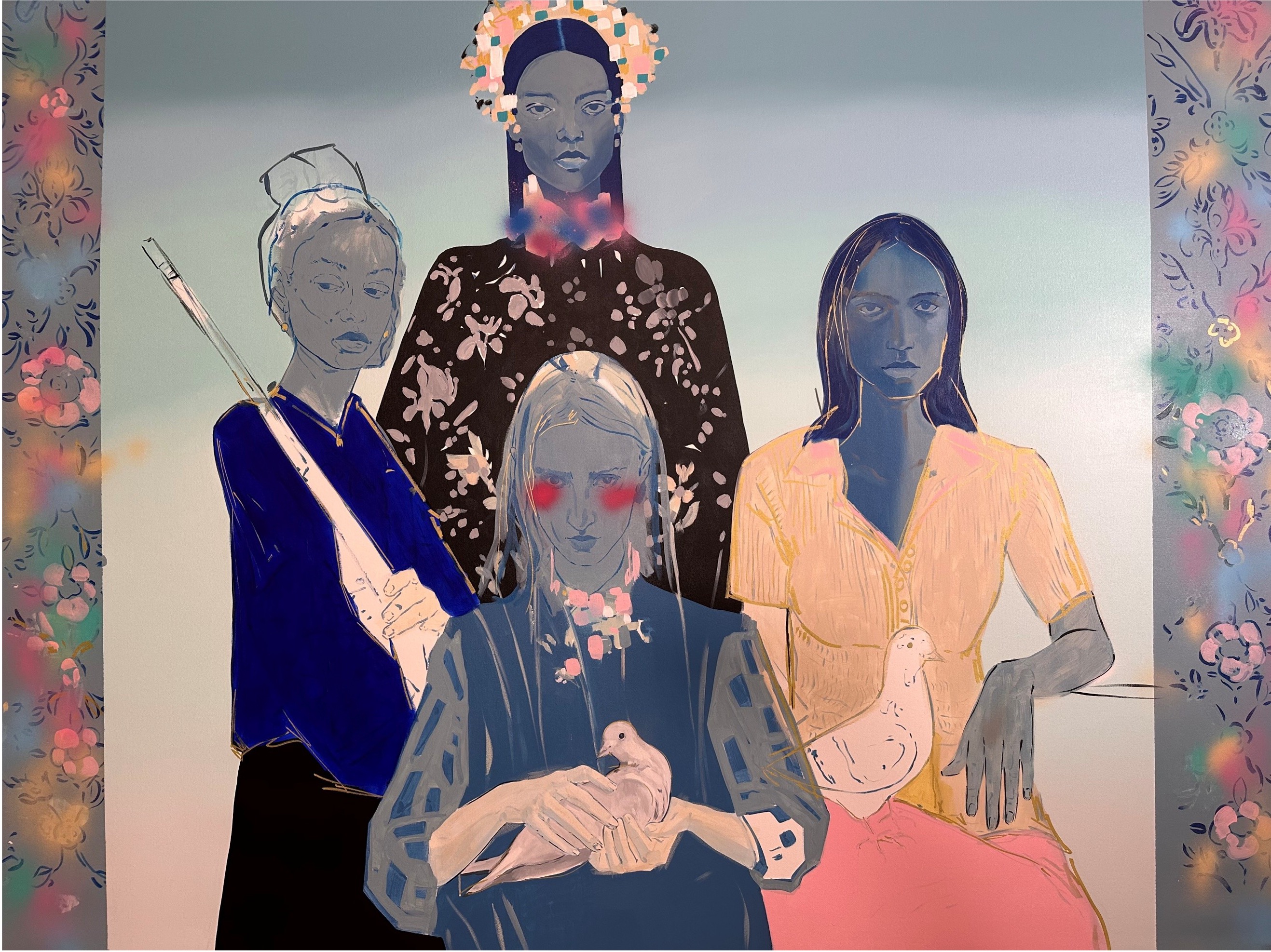 A group of women standing next to each other in front of a wall.