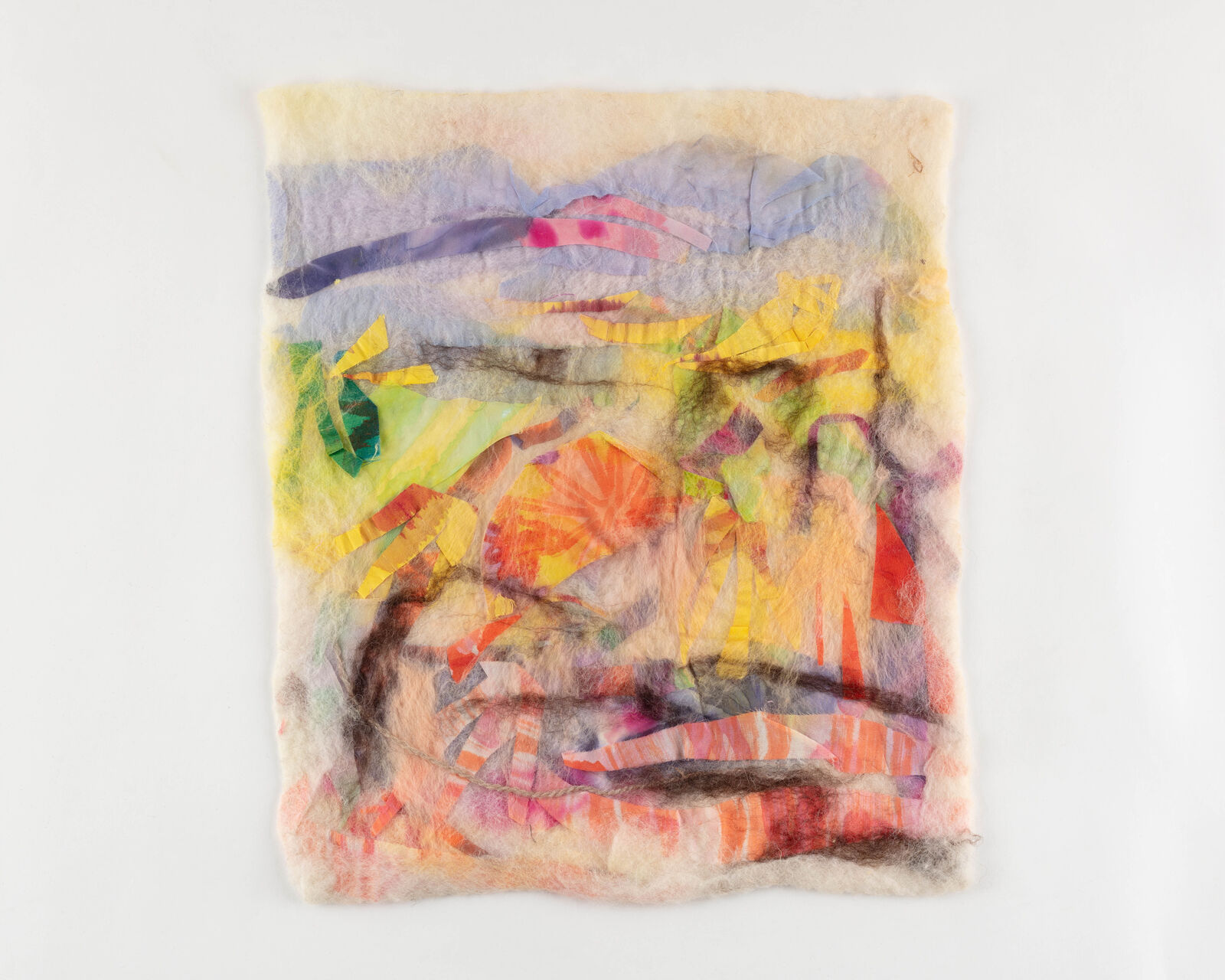 A colorful, textured textile artwork featuring a landscape scene with vibrant hues and layered materials.