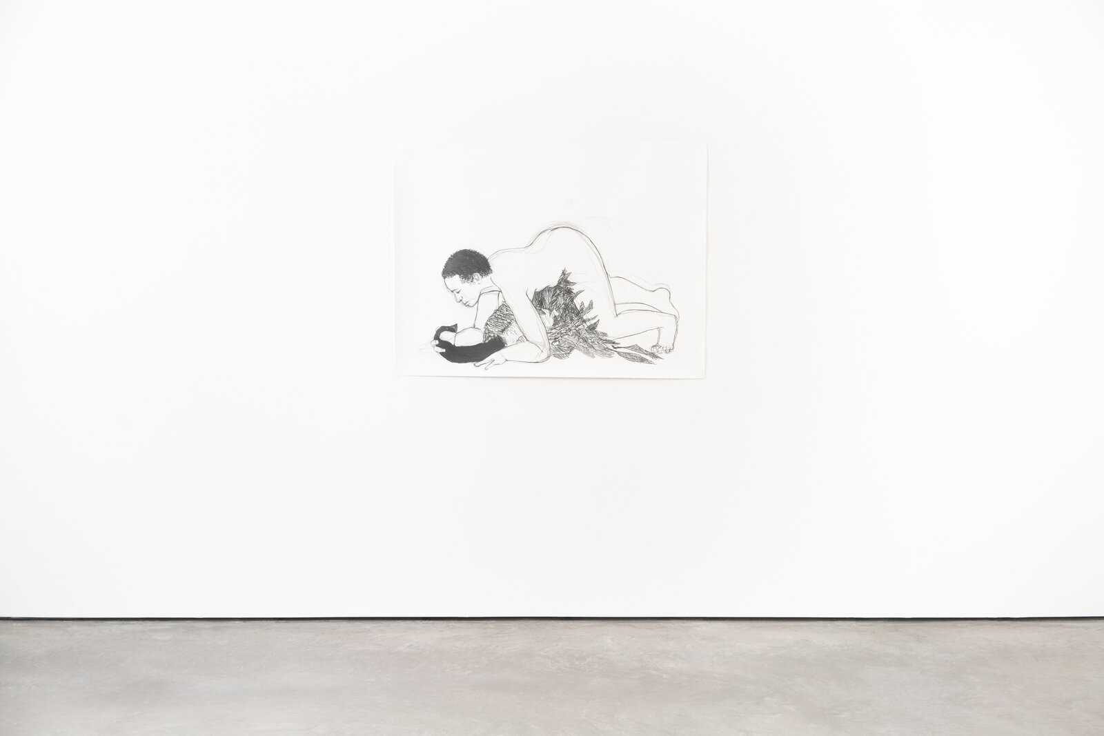 A drawing of a man and a woman laying on the ground.