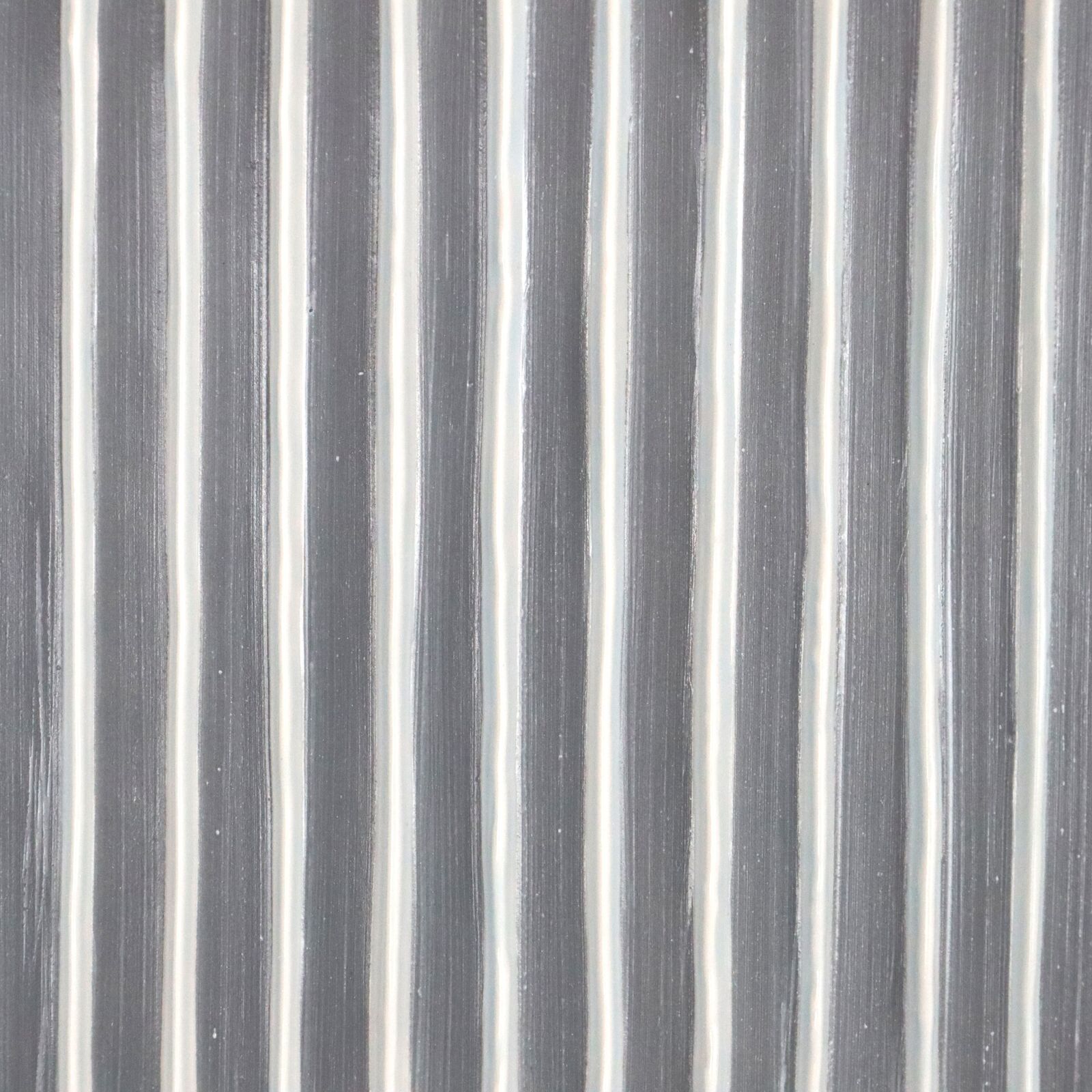 Two pieces of yellow and blue paper on a white surface.