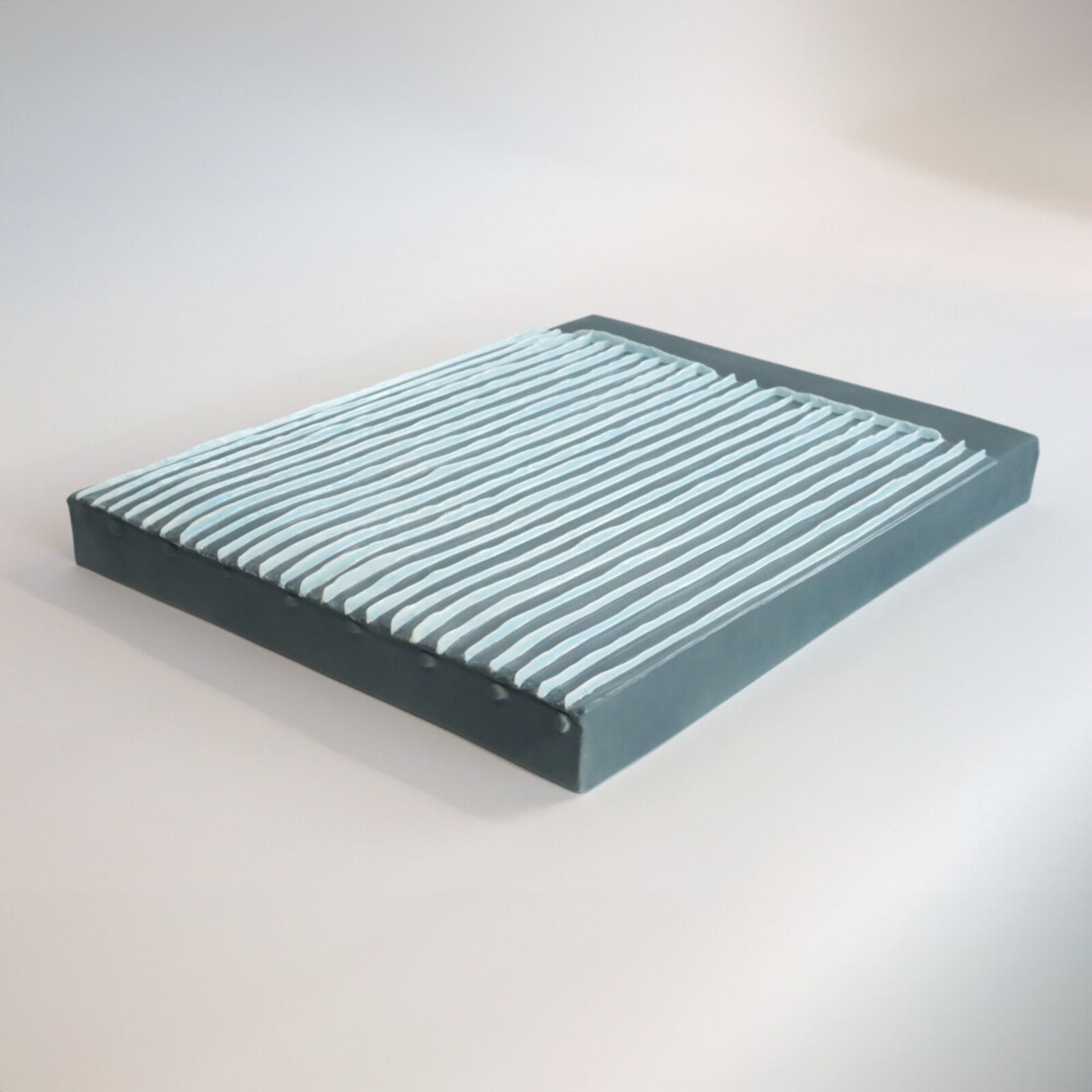 Two pieces of yellow and blue paper on a white surface.