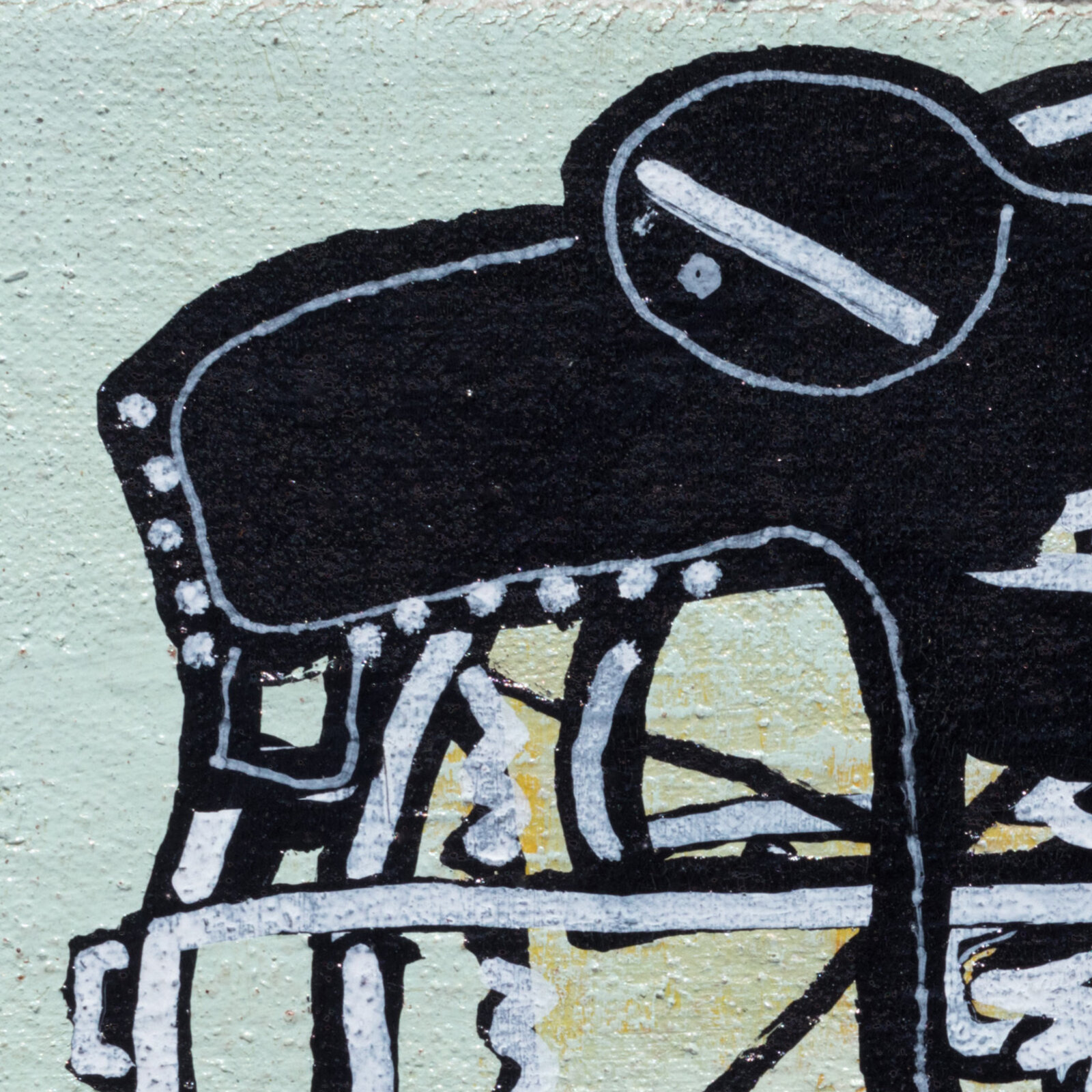 A black and white drawing of a bird sitting on top of a table.