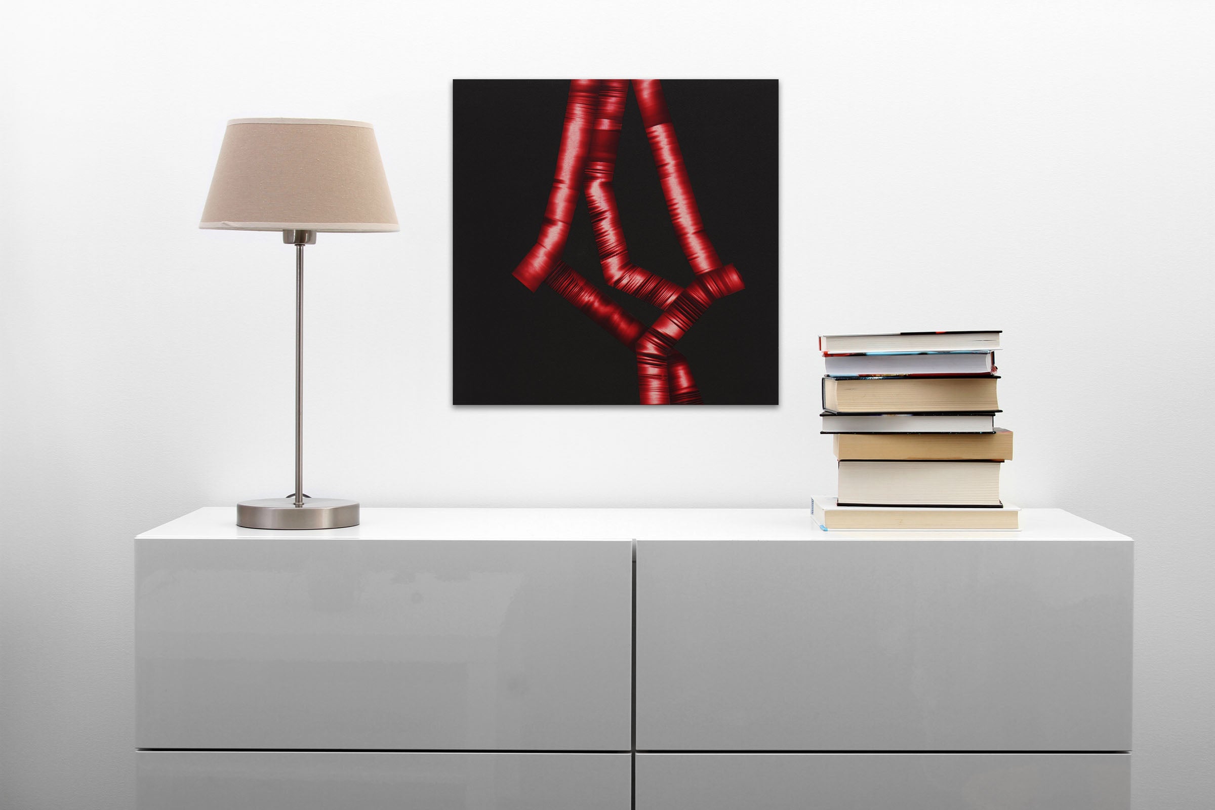 A black background with red ribbons on a black surface.