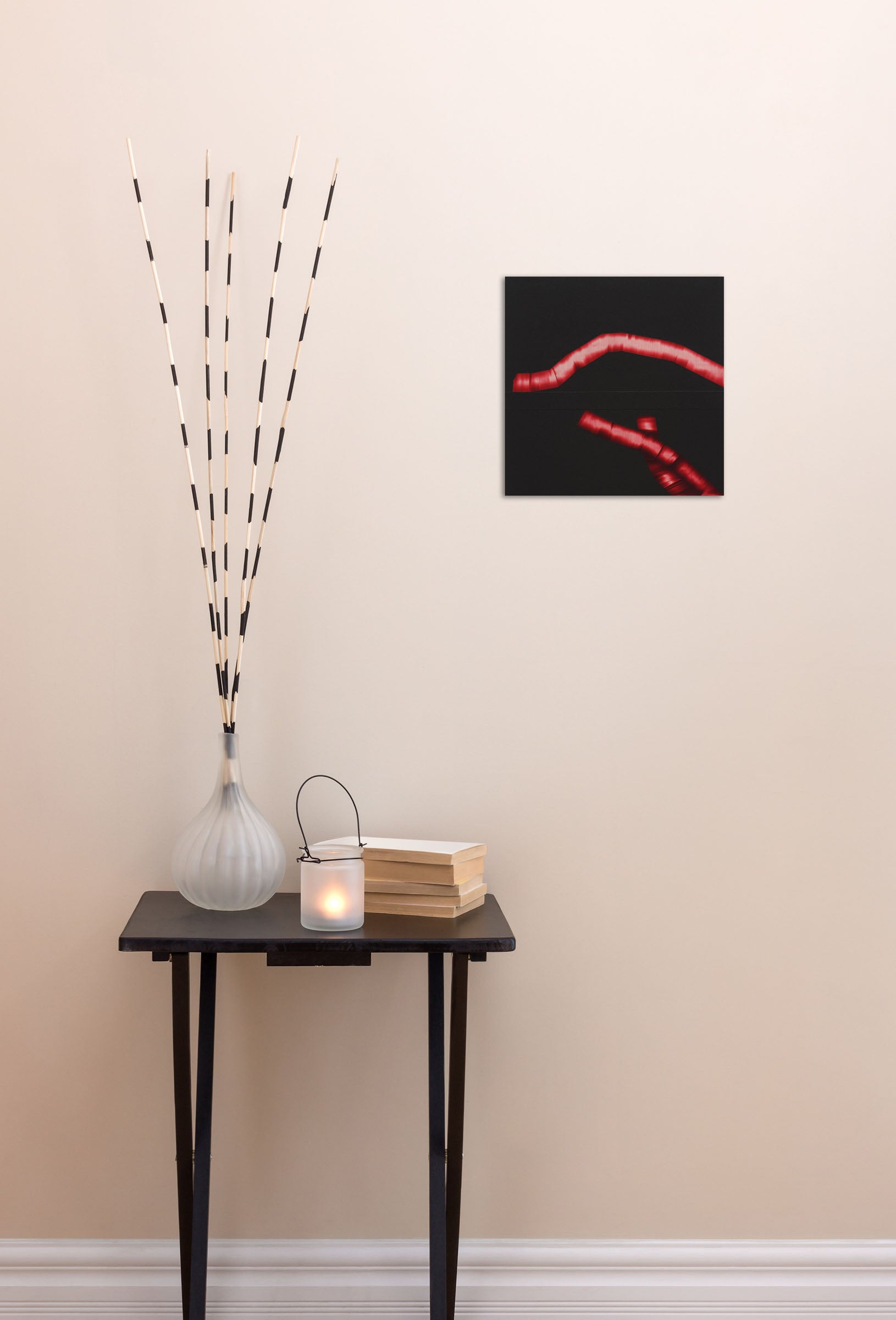 A black background with a red ribbon wrapped around it.