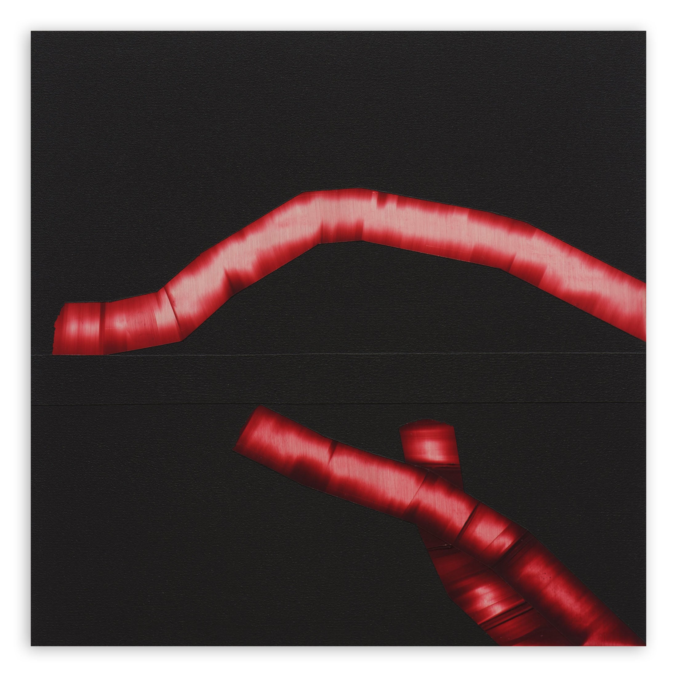 A black background with a red ribbon wrapped around it.