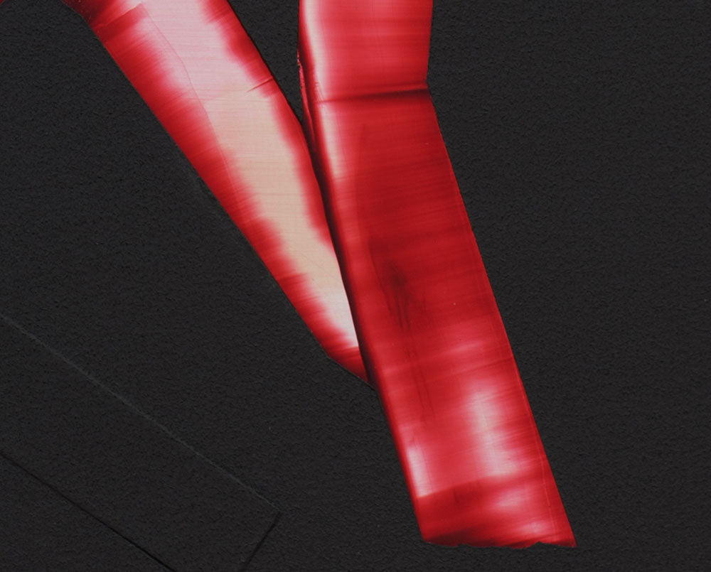 A red and black poster with the letter N on it.
