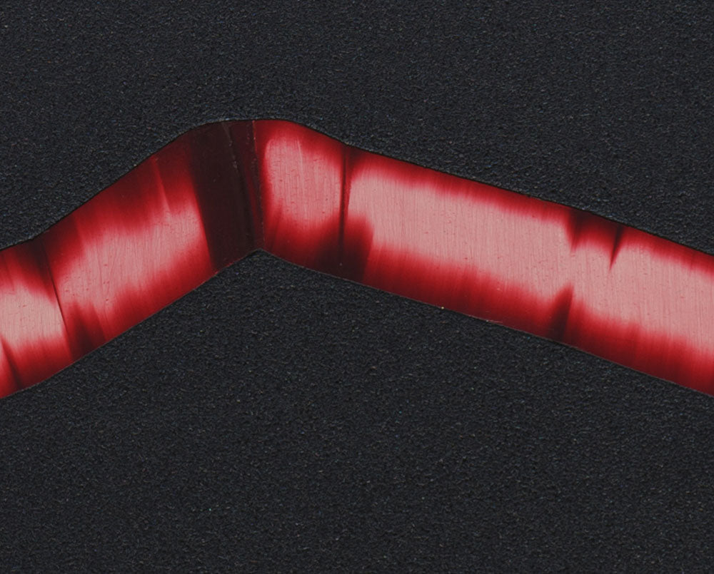 A red ribbon on a black background. 