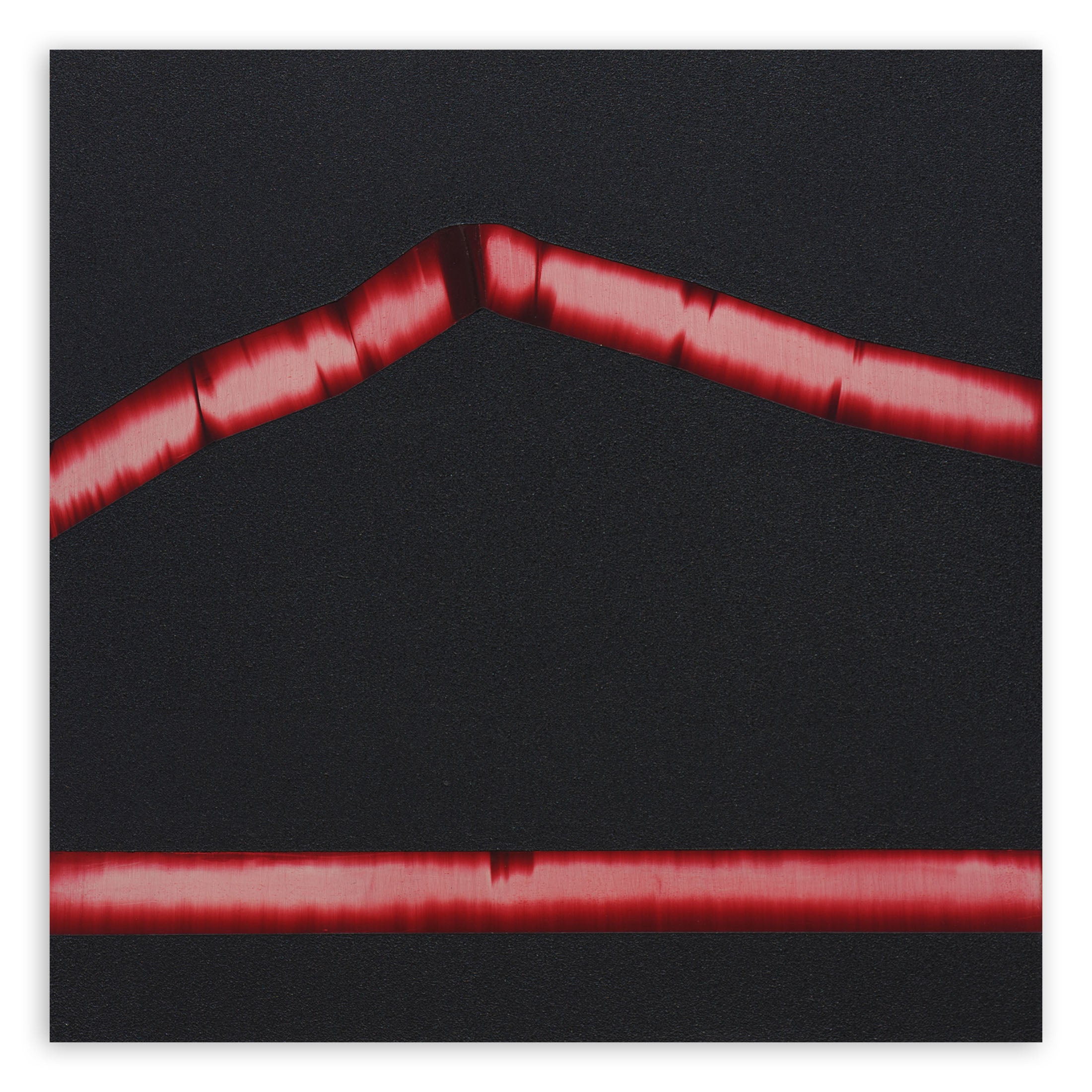 A red ribbon on a black background. 