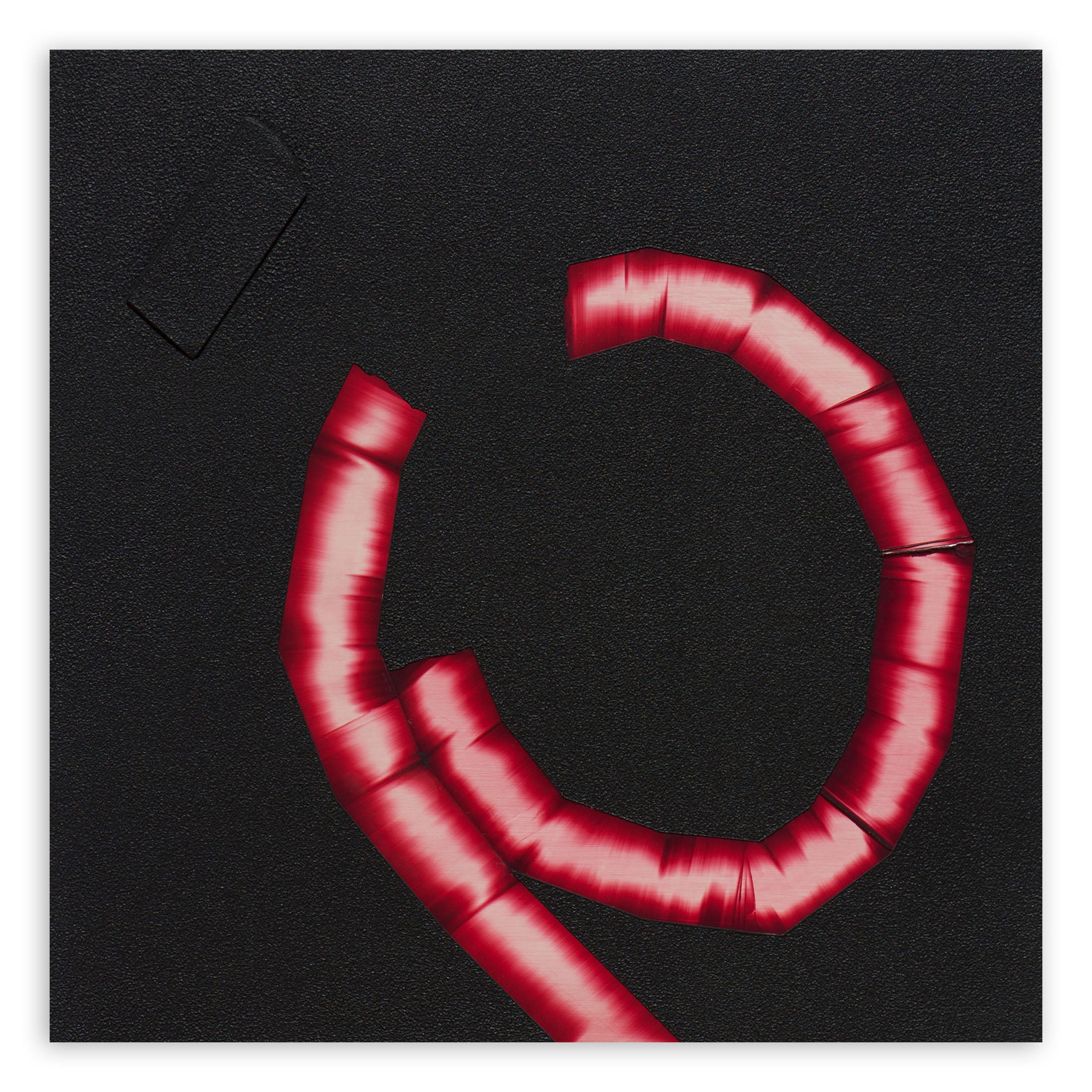 A red letter C on a black background. 
