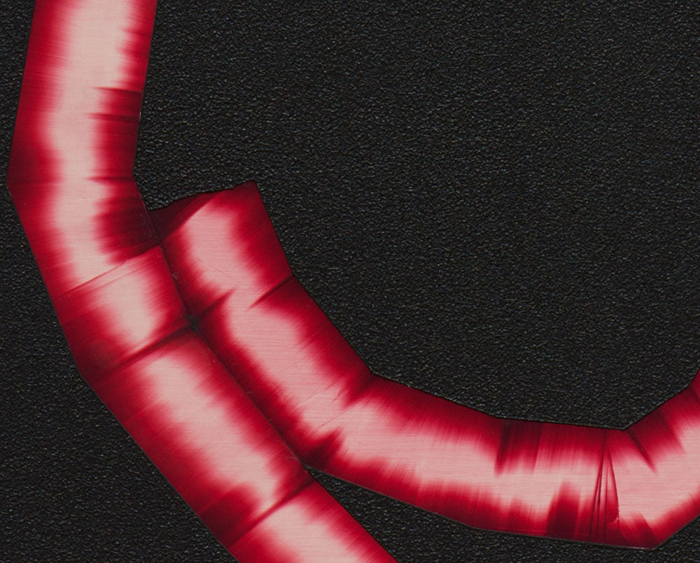 A red letter C on a black background. 