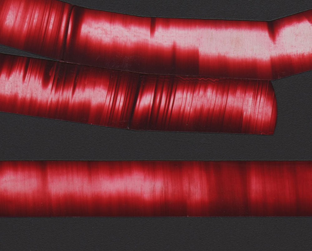 A picture of a red letter Q on a black background.