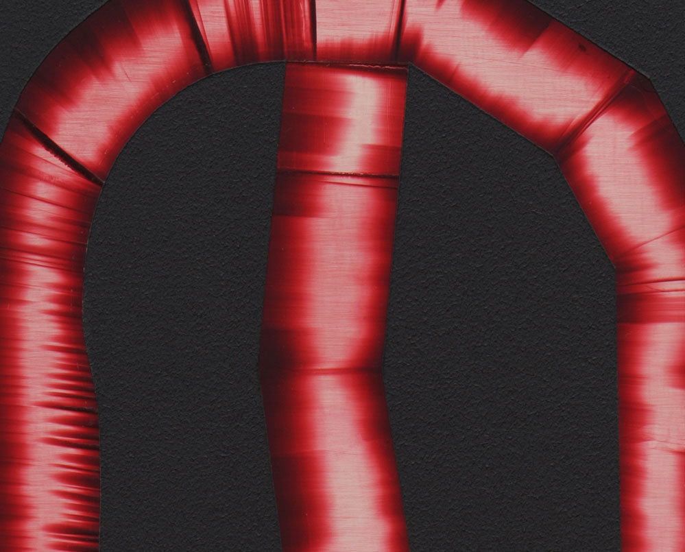 A red letter D on a black background.