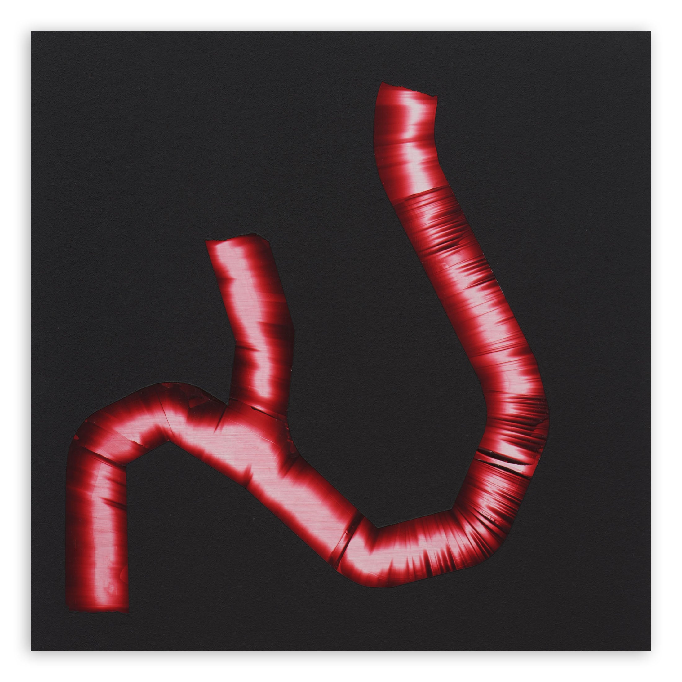A red pipe on a black background. 