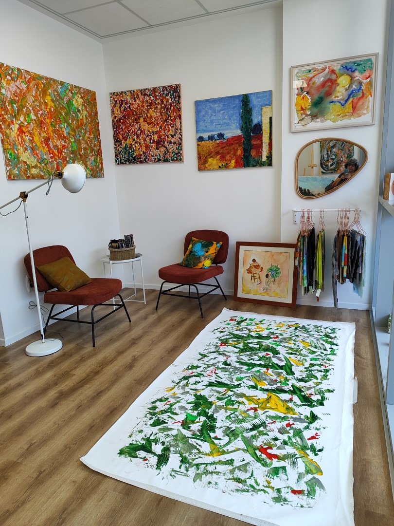 A painting with green, yellow and red paint on it.