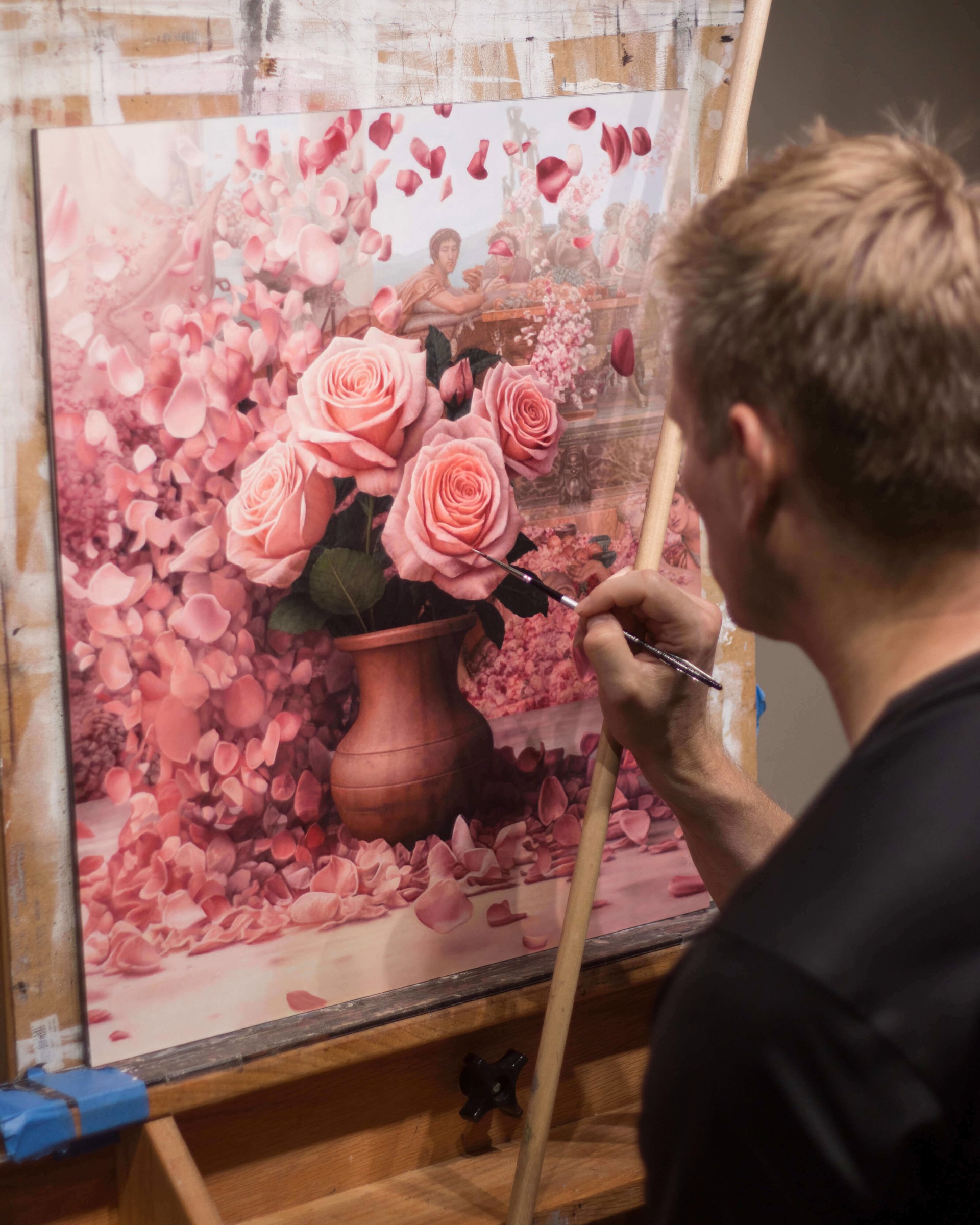 A painting of pink roses in a vase surrounded by petals.