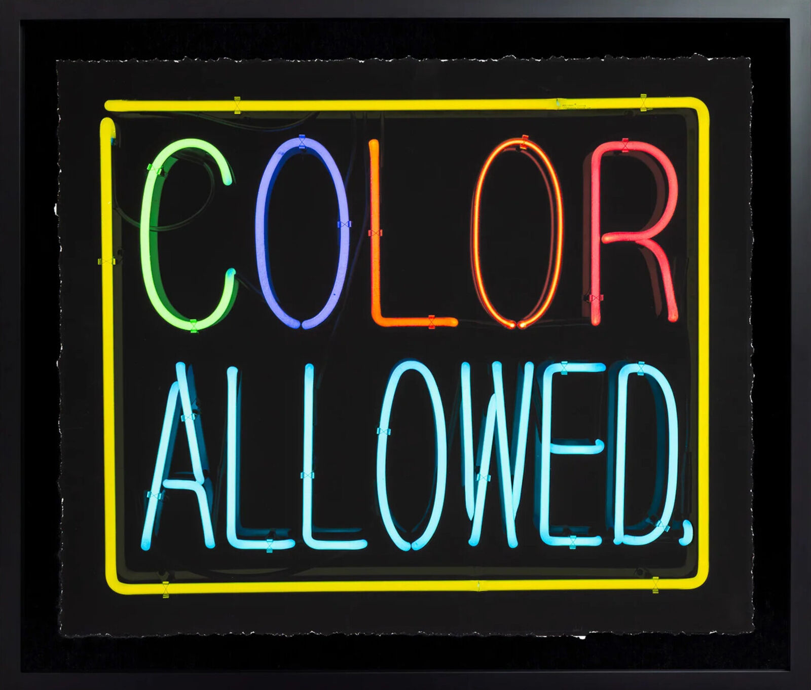 A neon sign that says color allowed on a black background.