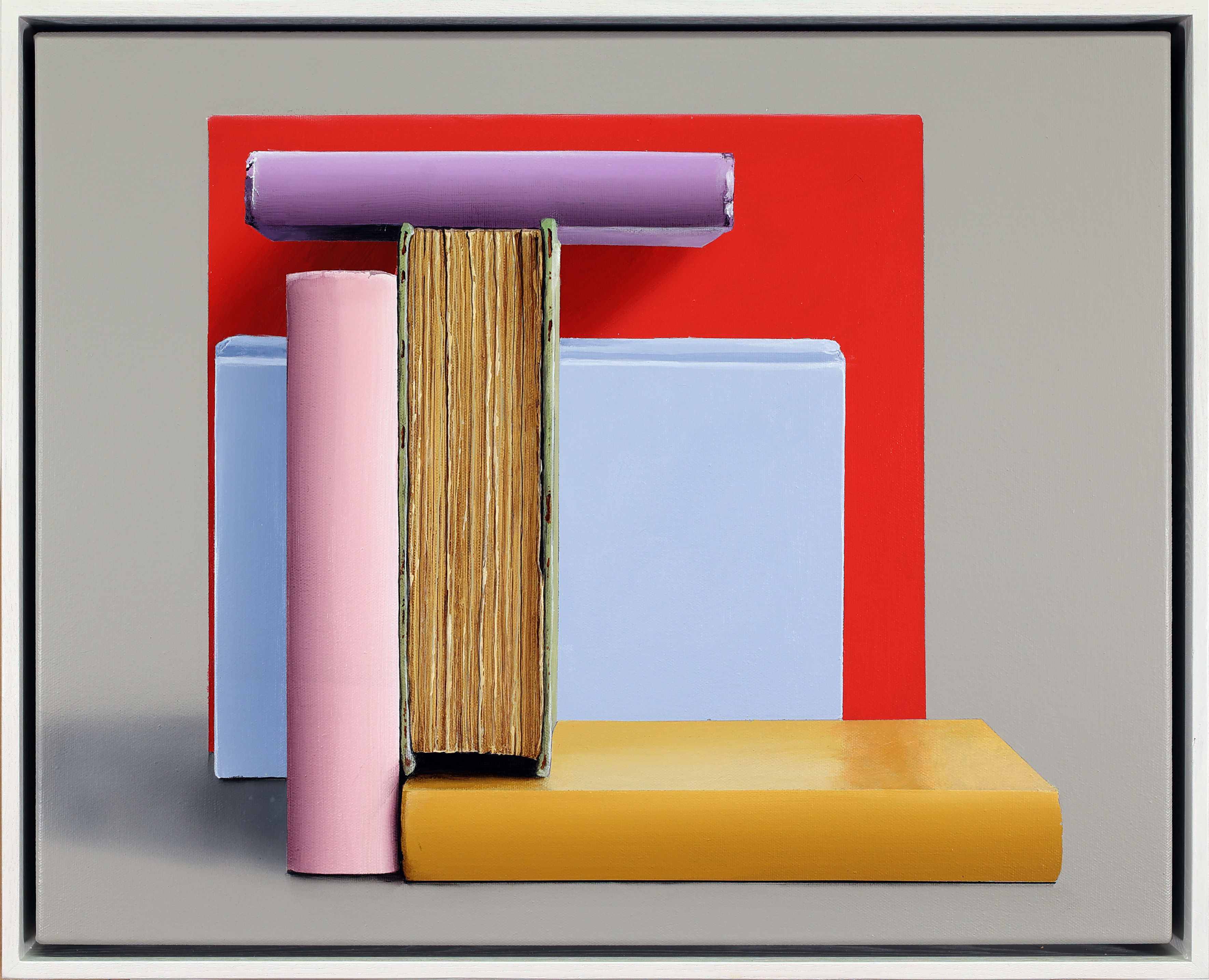 A picture of a stack of books on a shelf.