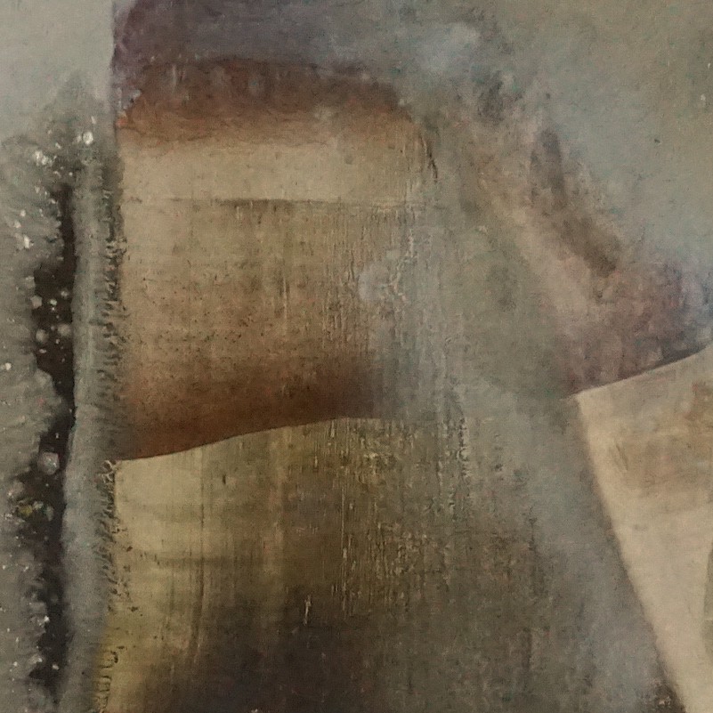 An abstract composition of layered earthy tones with visible texture.