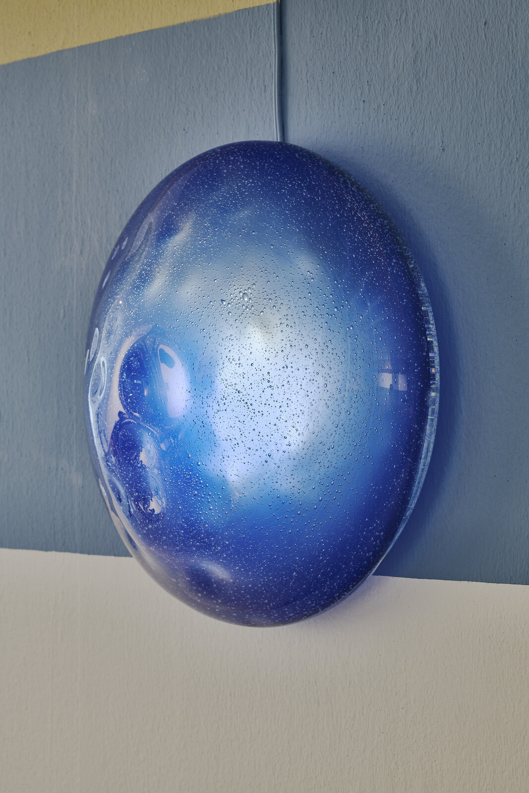 A black and white drawing of a man's face on a wall.